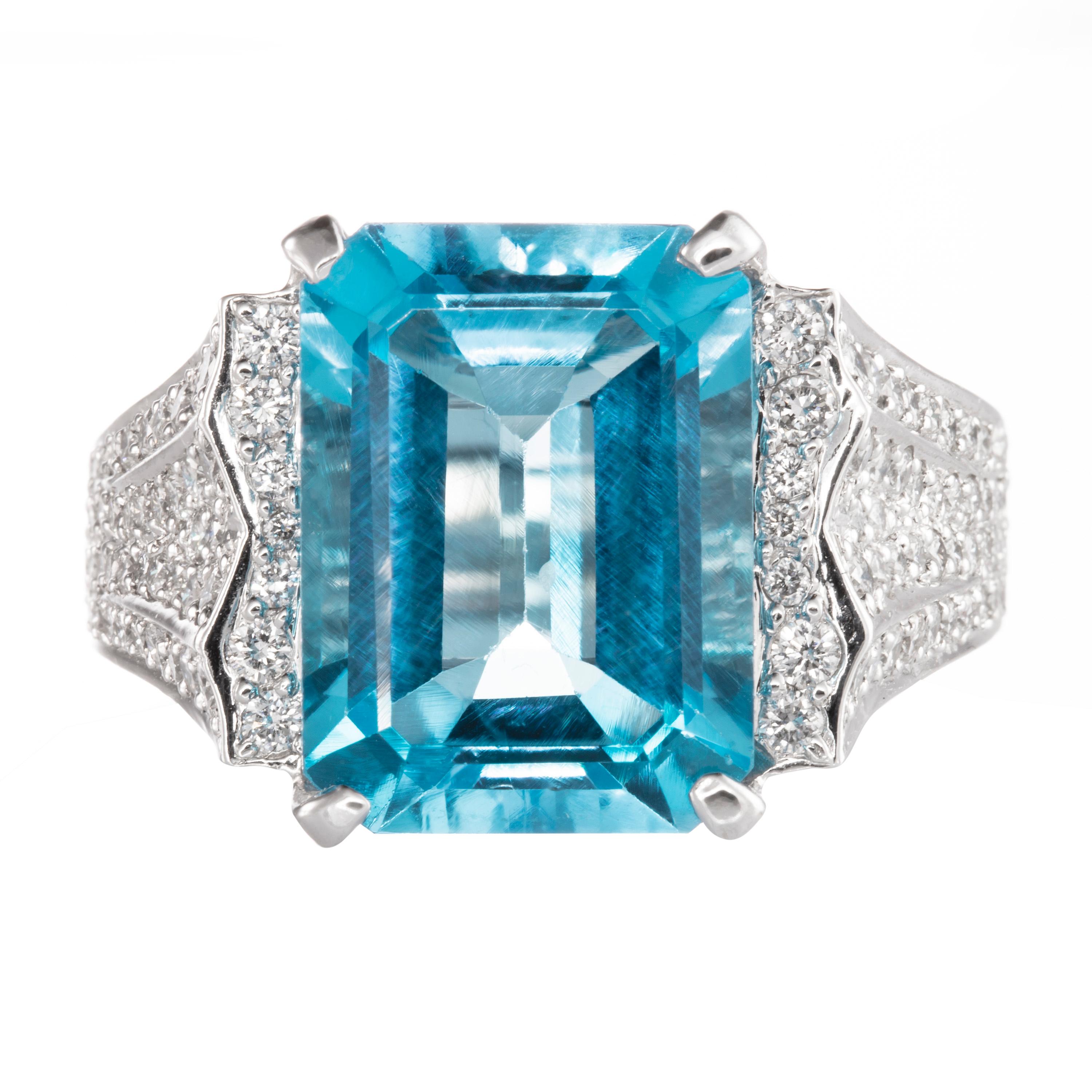 Cast from 18K white gold and adorned with 1.45 carats of white pave diamonds, this stunning ring has a 11.23 carat emerald-cut blue topaz at the center. Give it as a gift, or pick it out for your wedding.  Currently a ring size US 6.5.  For other