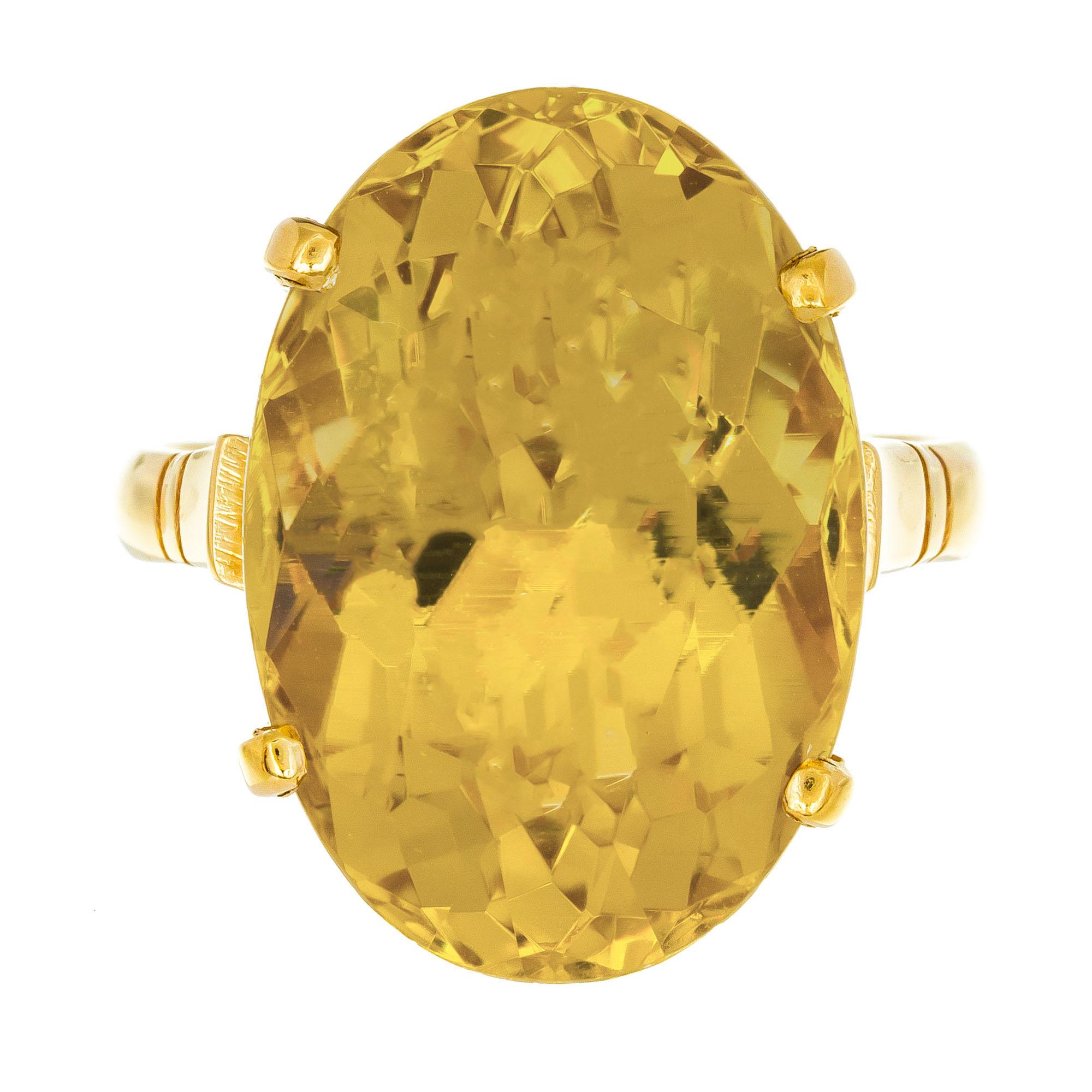 1960's Oval natural golden citrine ring in 18k yellow gold cocktail setting. 

1 oval golden yellow citrine, VS approx. 11.25cts
Size 6.5
18k yellow gold
Stamped: 750
6.9 grams
Width at top: 18.3mm
Height at top: 9.9mm
Width at bottom: 2.5mm

