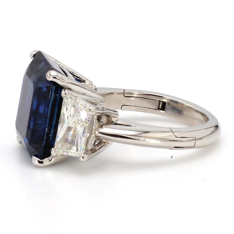 For sale is a platinum AGL and GIA certified 11.29ct Emerald cut, Thai Sapphire and diamond ring, accented with trapezoid cut diamonds.

CENTER STONE: 11.29ct Emerald Cut, Thai Sapphire (No Heat)

ACCENT/SIDE STONES: 0.97ct H VS1 Trapezoid Cut