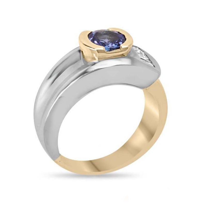 Setting Style: Bezel/Channel
Setting Material: Yellow & White Gold 14K
Setting Weight: 8.5 Grams

Main Stone: Tanzanite
Shape: Round
Approx Weight: 1.0-Carats
Clarity: Transparent
Color: Purple
Luster: Excellent
Treatments: Natural, Heat

Secondary