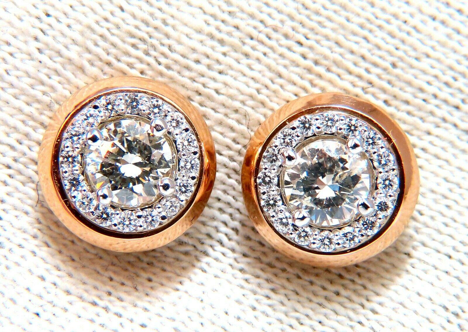  Halo Studs Diamond earrings.

.78ct Natural Round brilliant diamonds (2) 

 Si-1 clarity J-color

.34ct Round Diamond Accents Sorround

G-color, Vs-2 clarity.

Earrings: 10mm diameter

14kt. white / rose gold 

4.4 grams.

Comfortable butterfly &