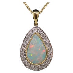1.12ct Pear Shape Opal
Diamond Cluster Pendant 18 Karat Yellow and White Gold 1.12ct Pear Shape Opal
Diamond Cluster Pendant 18 Karat Yellow and White Gold