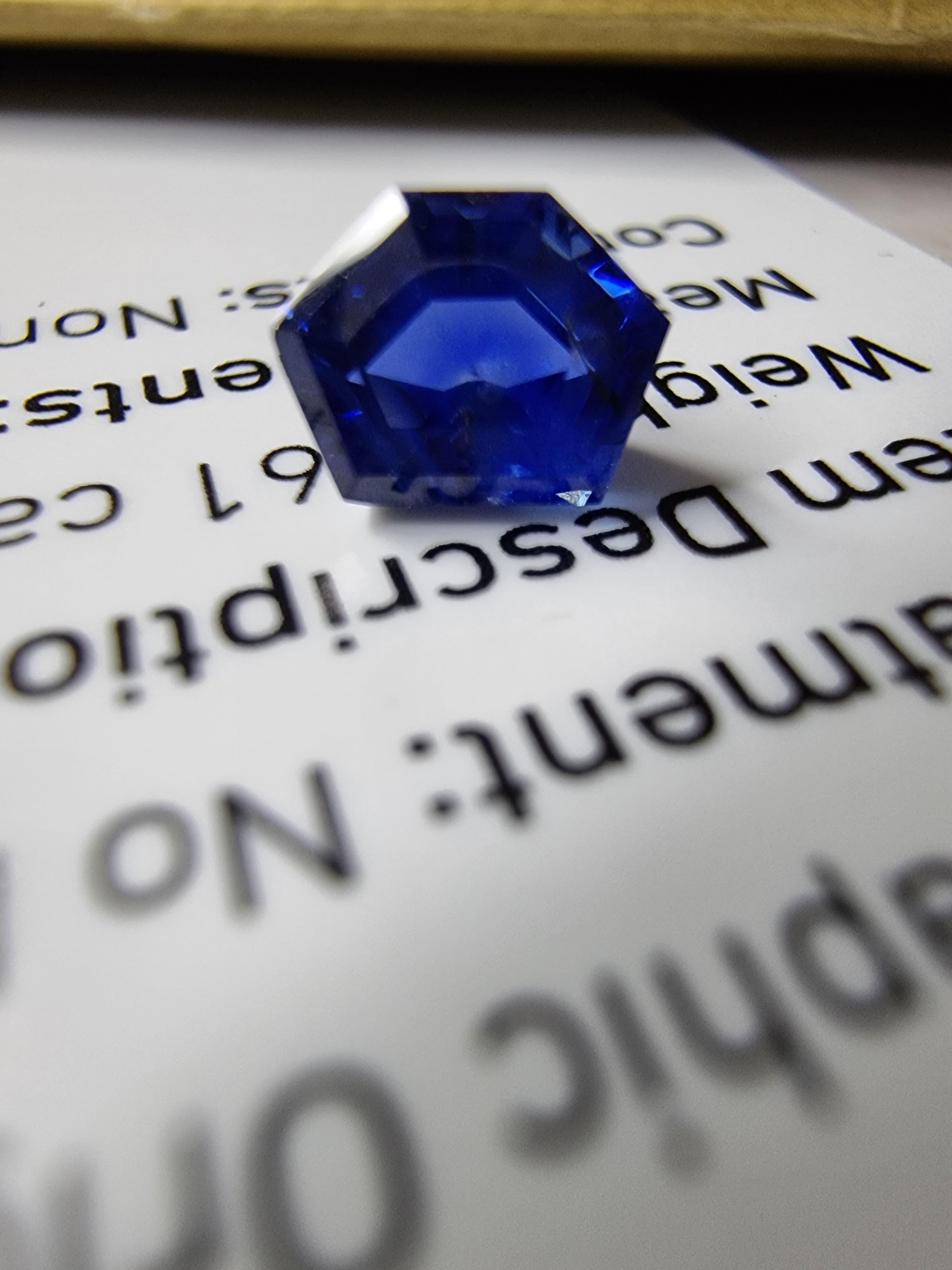Discover the allure of this exquisite 1.12-carat natural blue sapphire, masterfully cut into a unique pentagon shape. This gemstone radiates a deep, mesmerizing blue hue, making it a perfect choice for custom jewelry designs that demand a touch of