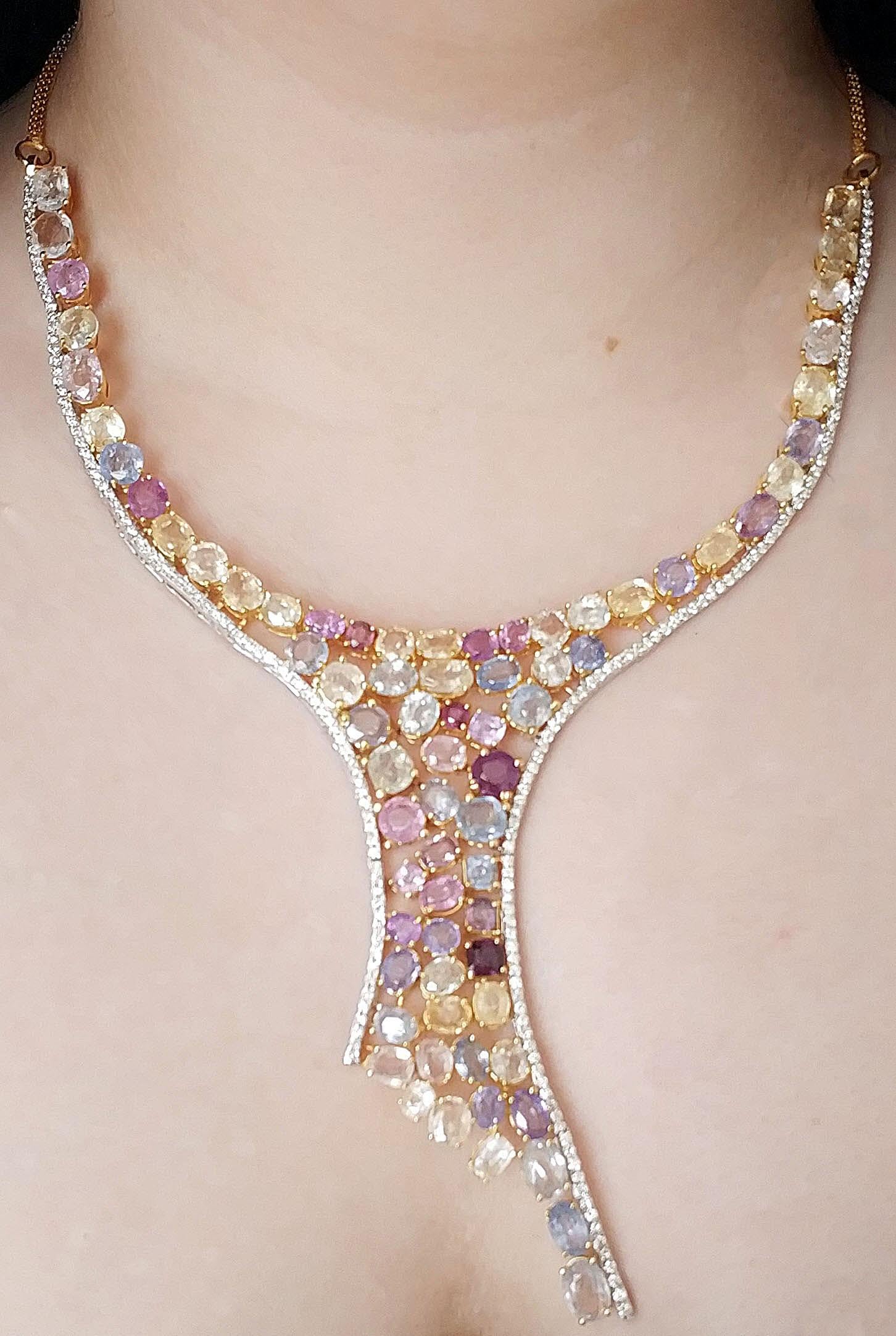 A top quality hourglass design
106.4 carat multicoloured sapphire and 6.2 carat diamond necklace 
Solid 18 carat gold
Weight- 71.1 gms.
The sapphires and diamonds are all natural and untreated- certified.
RRP for this necklace is £51000
Extremely