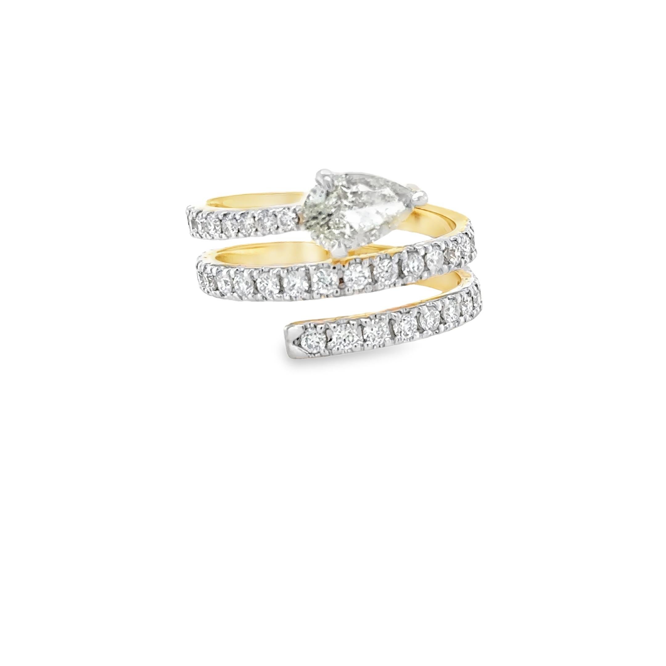 This exquisite 1.13 carat Pear shape diamond spiral cocktail ring features 18K White & Yellow Gold Pear-Shaped Diamond and is set with one Pear cut natural Diamond and thirty Seven round brilliant cut natural diamonds. 
This Beautiful Yellow