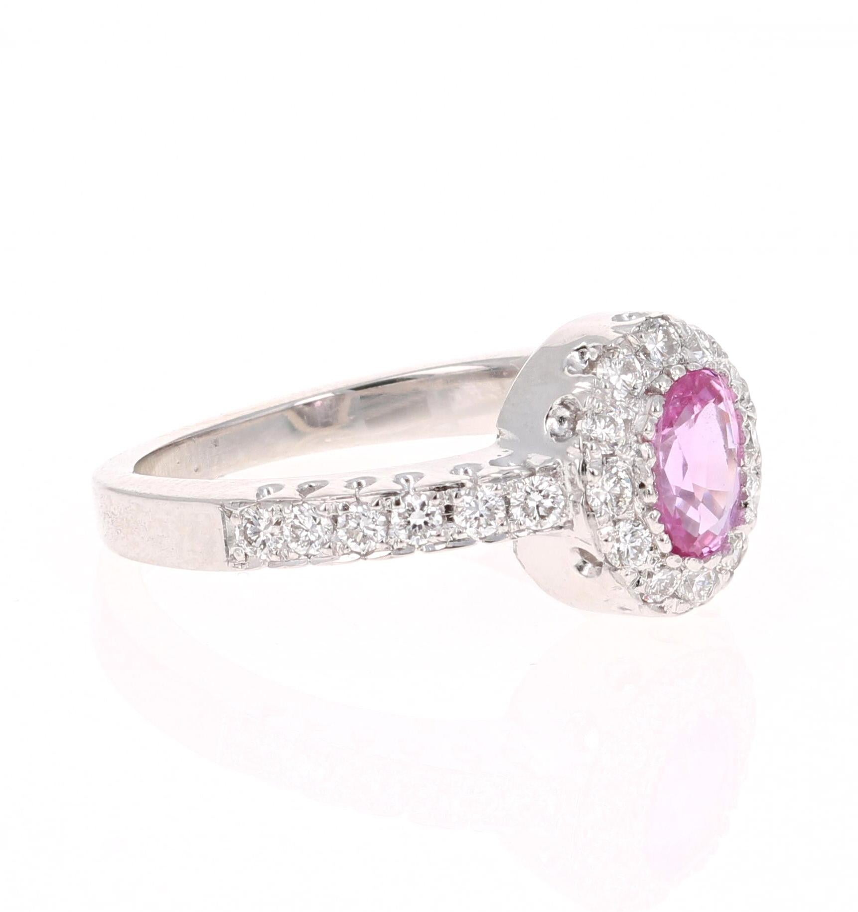 Cute Pink Sapphire and Diamond Ring! Can be an everyday ring or a unique Engagement Ring!

This beautiful ring has a Oval Cut Pink Sapphire that weighs 0.69 Carats. 

The ring is embellished with 24 Round Cut Diamonds that weigh 0.44 Carats with a