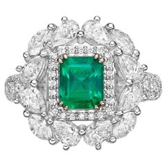 1.13 Carat Sunflower Emerald Bridal Ring in 18KWYG with White Diamond.