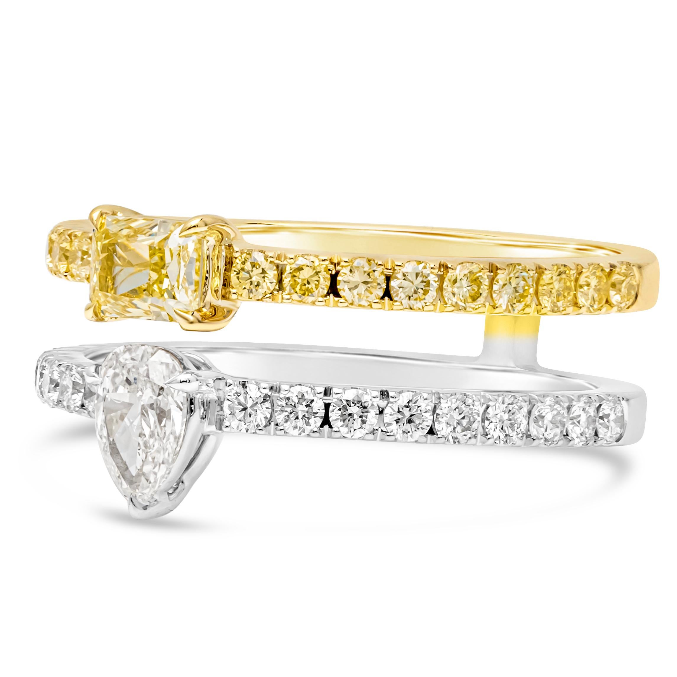 This exquisite double band fashion ring features a stunning combination of elegance and vibrancy. One band showcases fancy color cushion cut diamond center stone, accented with pave round fancy color diamonds, set in a 18k yellow gold. The other