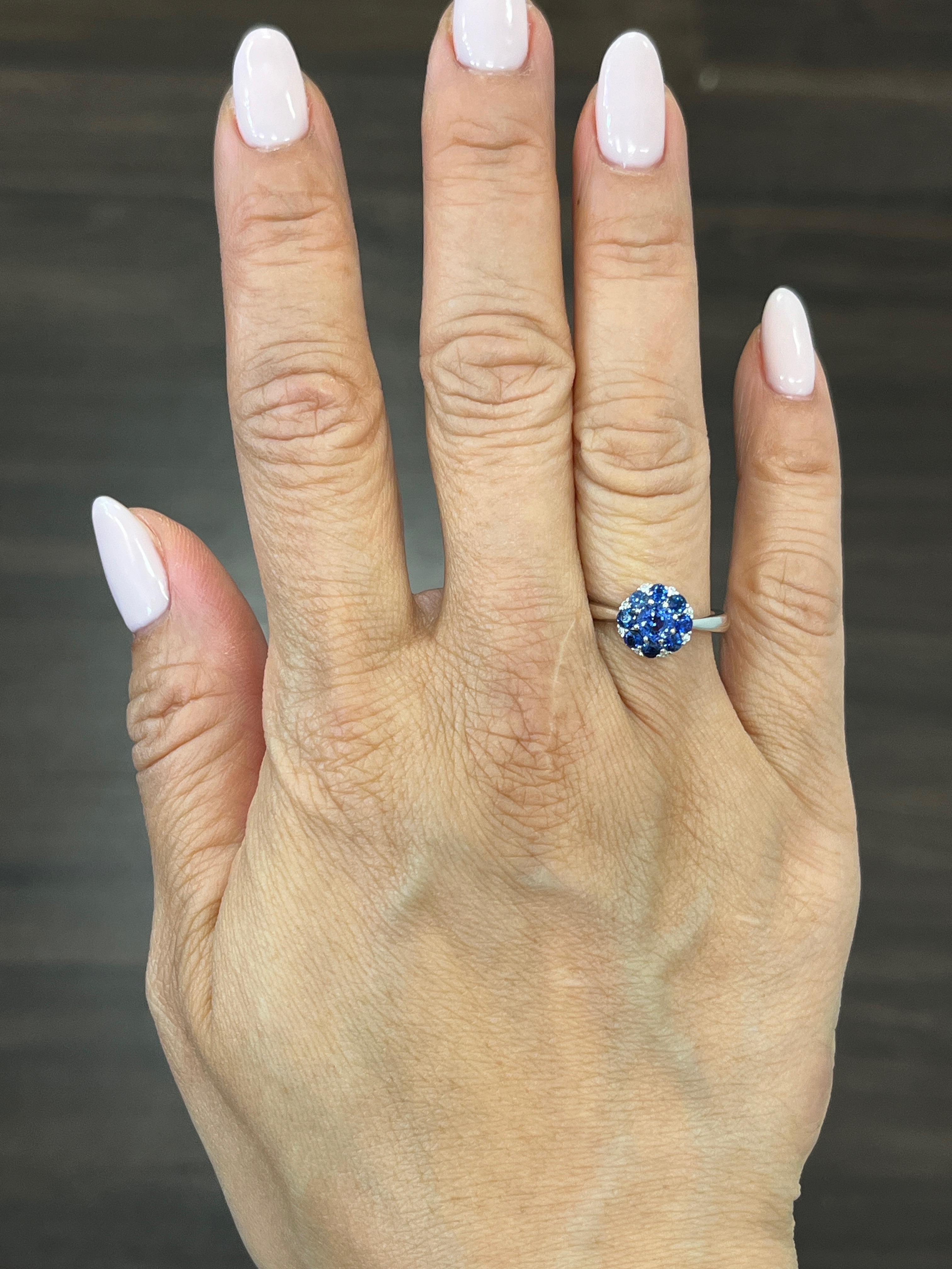 This beautiful 18k natural sapphire and diamond ring weighs 1.13 ct. It features 9 blue sapphires weighing 1.08 ct. The natural sapphires are AAA quality, and the diamonds are F/G in color and VS1 in clarity. A gorgeous addition to any wardrobe. 