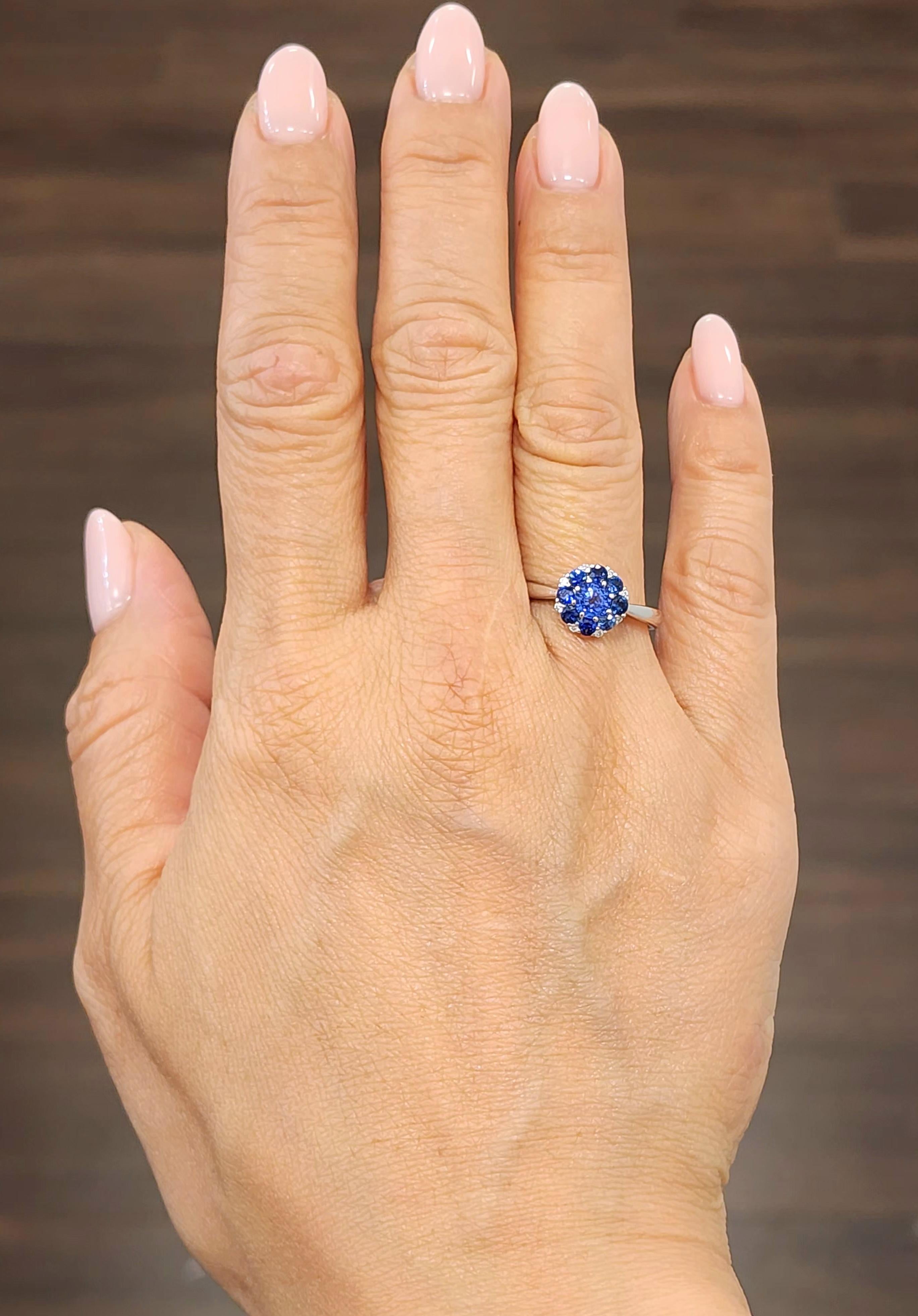 This beautiful 18k natural sapphire and diamond ring weighs 1.13 ct. It features 9 blue sapphires weighing 1.08 ct. The natural sapphires are AAA quality, and the diamonds are F/G in color and VS1 in clarity. A gorgeous addition to any wardrobe. 