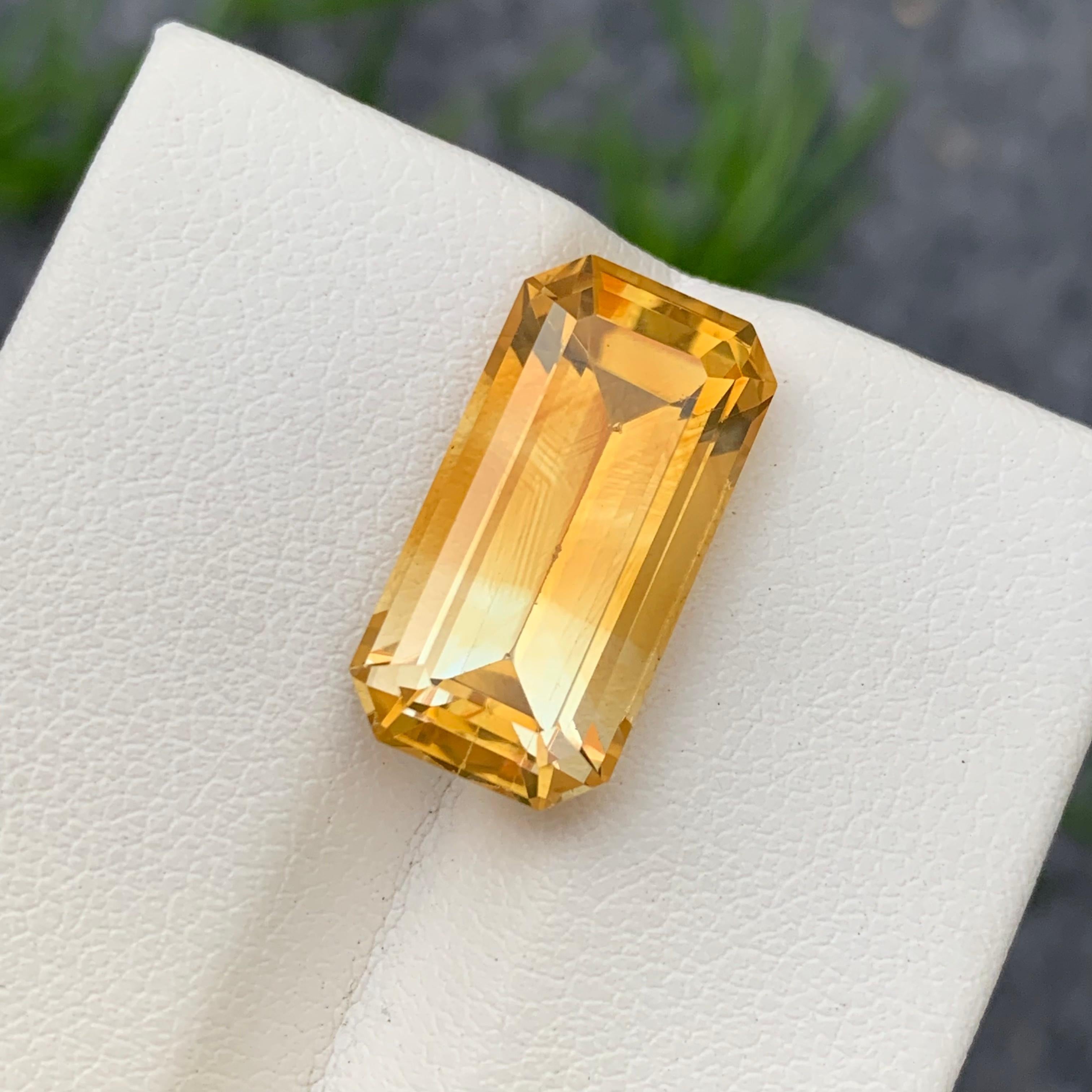 Faceted Citrine 
Weight: 11.30 Carats 
Dimension: 18.9x9.9x8.1 Mm 
Origin: Brazil 
Color: Yellow White
Shape: Emerald 
Treatment: Non
Certficate: On Customer Demand 
.
Citrine is a captivating gemstone known for its vibrant yellow to golden-brown