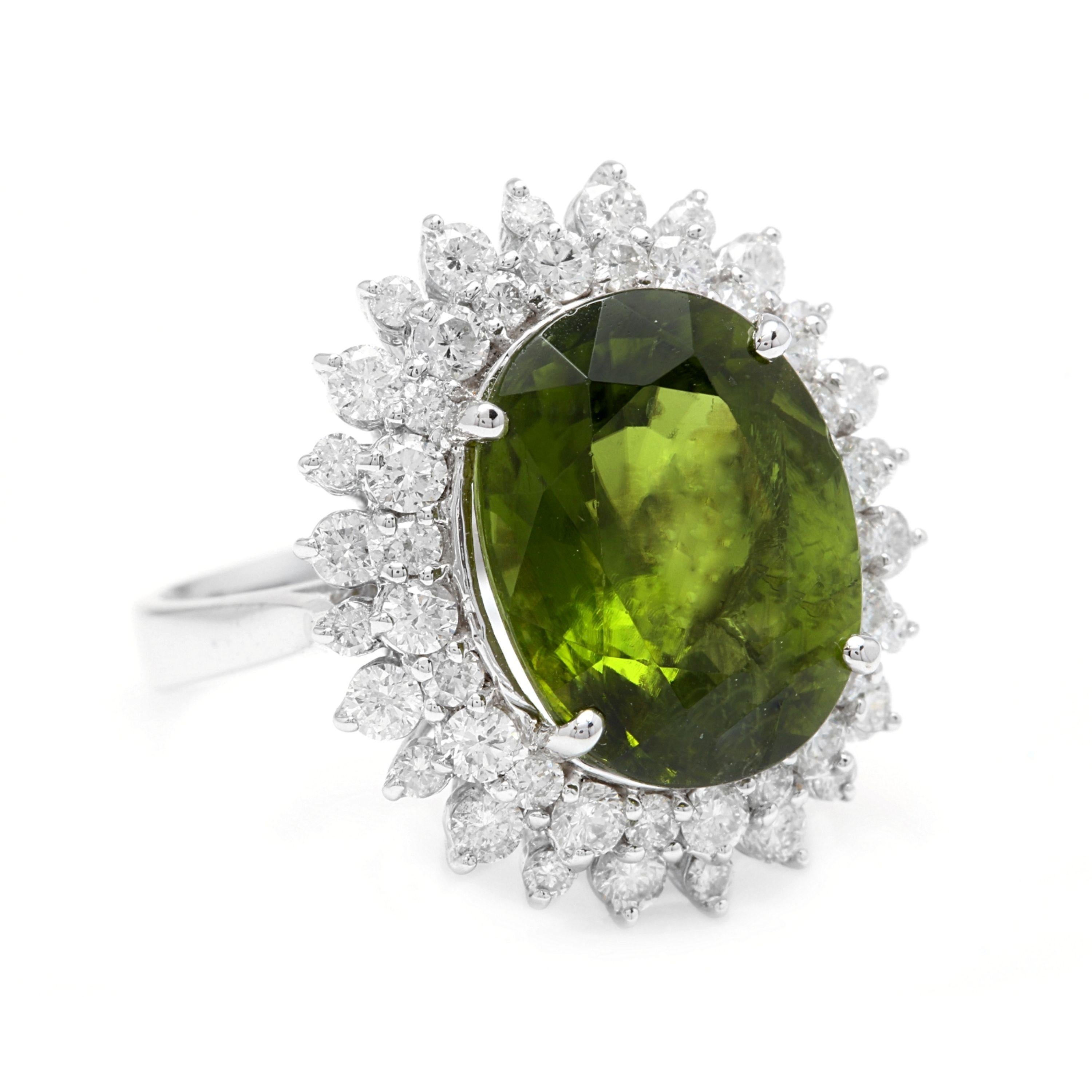 11.30 Carats Natural Very Nice Looking Green Tourmaline and Diamond 14K Solid White Gold Ring

Total Natural Oval Cut Tourmaline Weight is: Approx. 9.50 Carats

Tourmaline Measures: Approx. 14.00 x 11.00mm

Top of the ring measures: 22 x