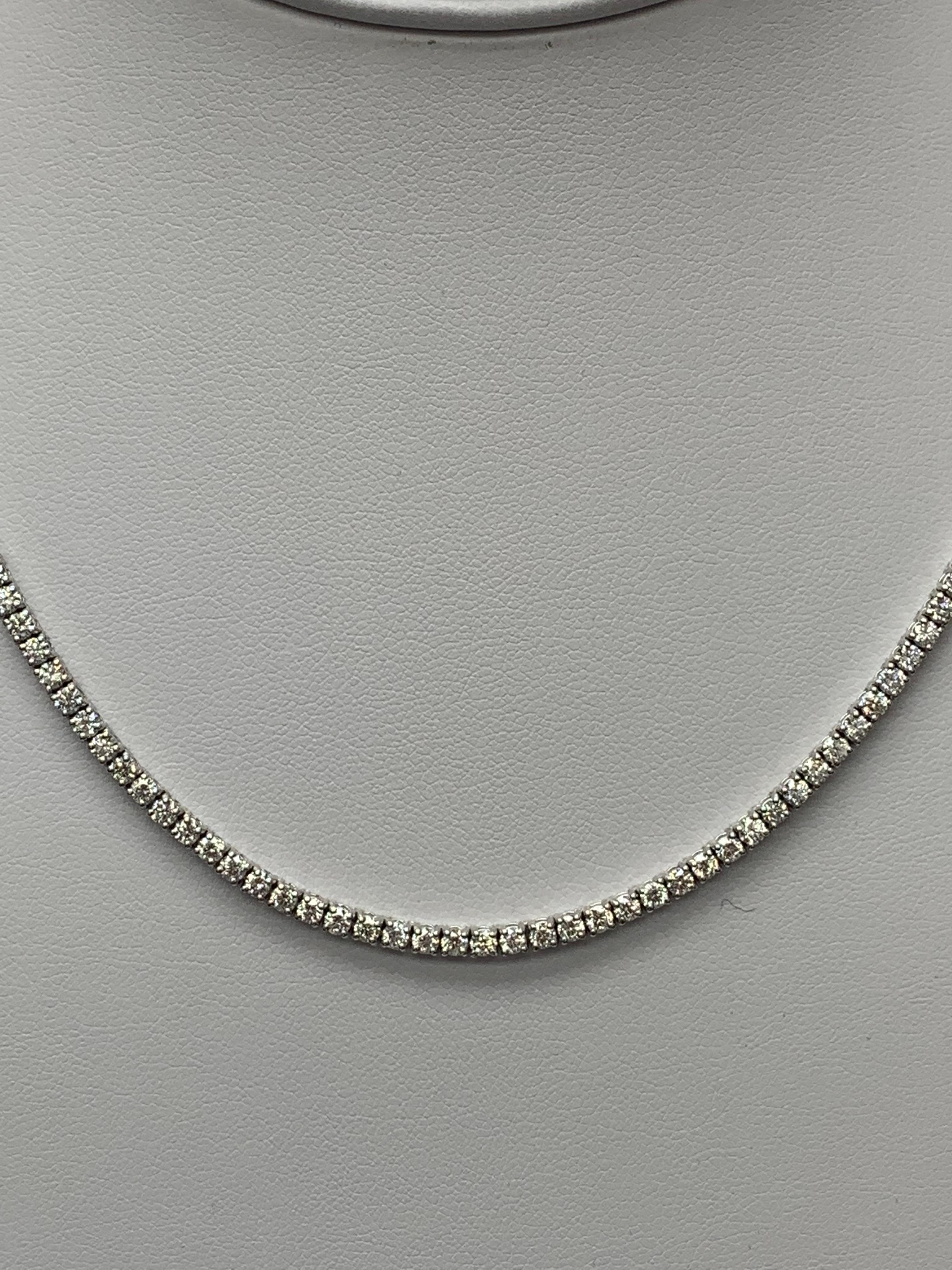 A brilliant and classic piece showcasing a line of round diamonds set in 14K White Gold. 156 diamonds in this necklace are brilliant round cut and weigh 11.31 carats in total. 16 inches in length.