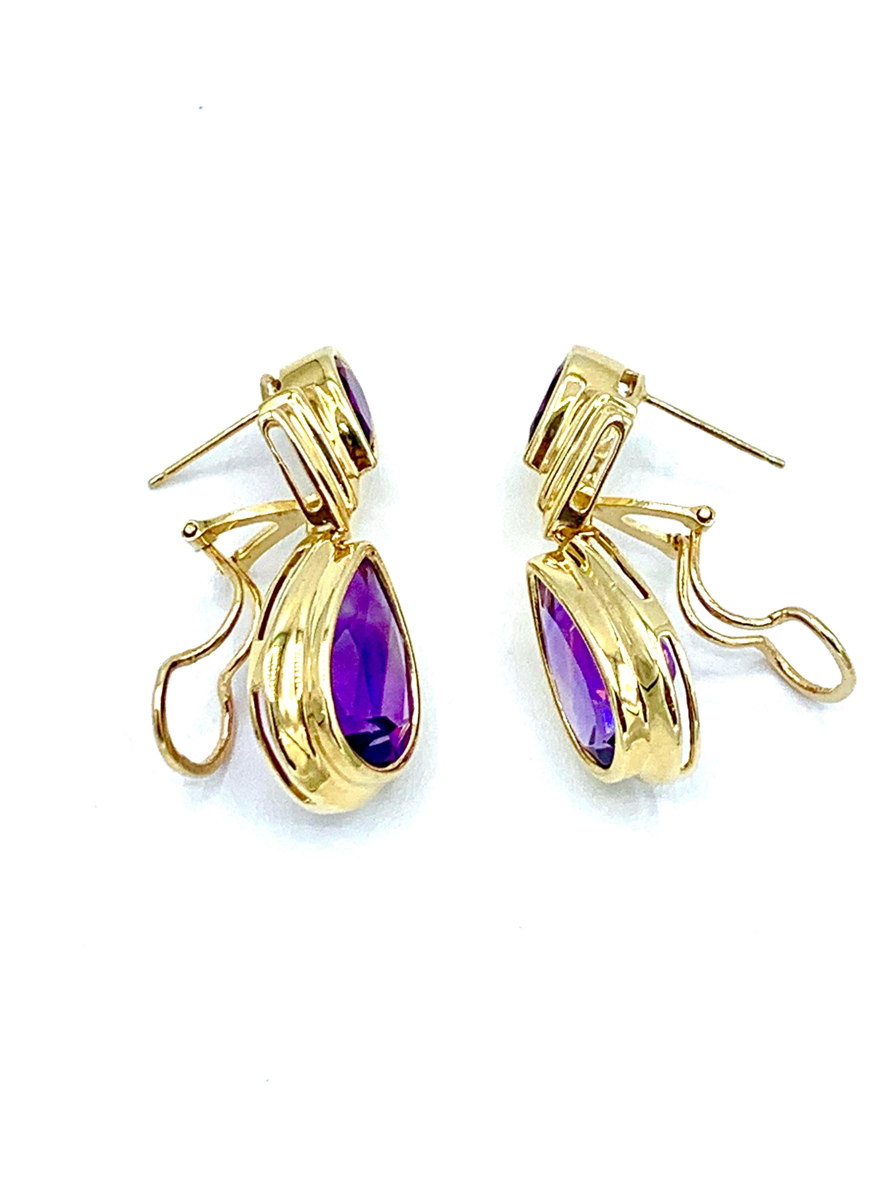 A beautiful pair of Amethyst earrings.  Each earring features two bezel set pear shape Amethyst .  The Amethysts weigh 11.32 carats total, and the earrings feature an omega back with a post.  These measure 1.20 inches in length.  Offered by Charles