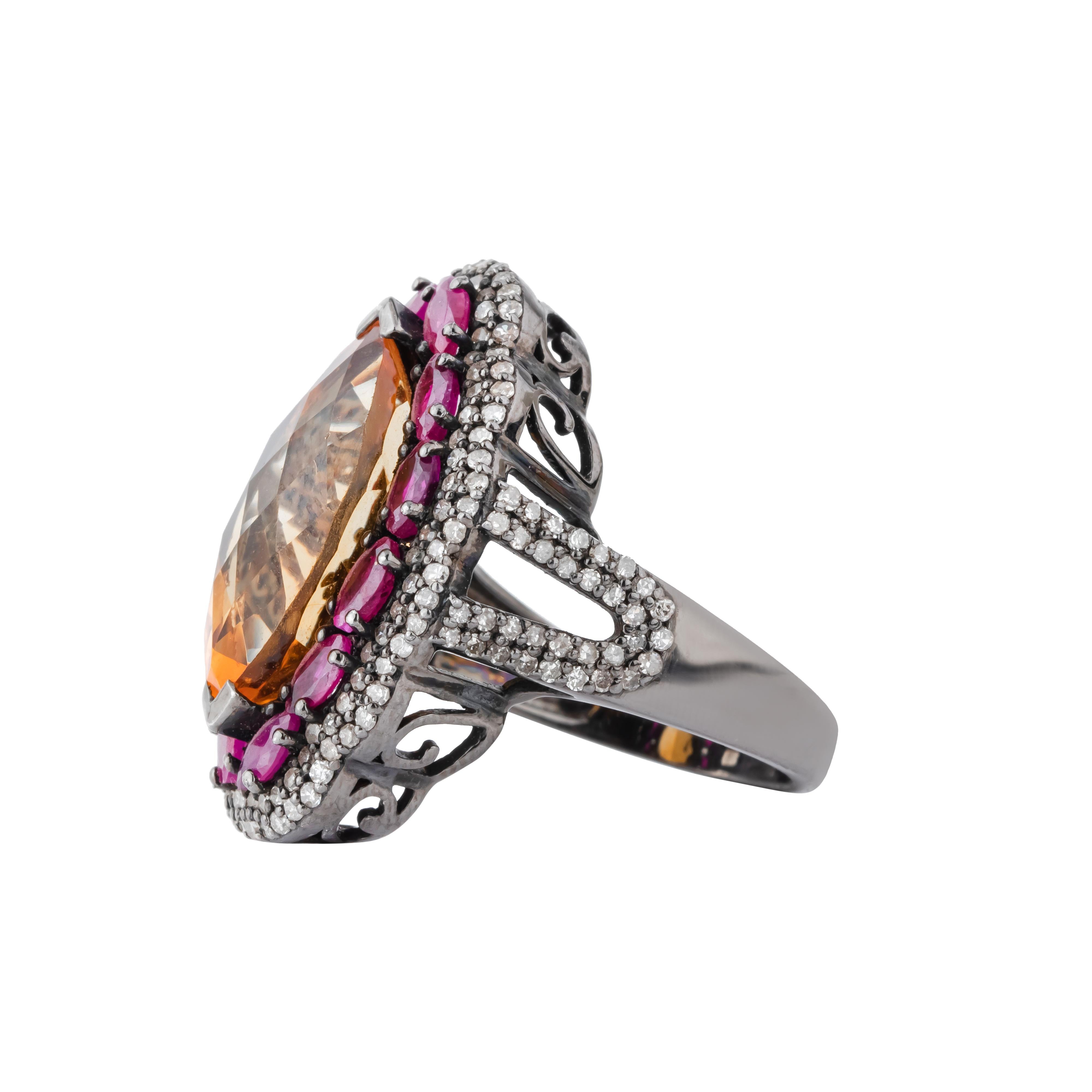 An epitome of opulence and sophistication, the 11.34 Carat Diamond, Golden Topaz, and Ruby Cocktail Ring is a true marvel of jewelry design. At its core, an extraordinary golden topaz captivates with its rich, amber hue and impeccable clarity.