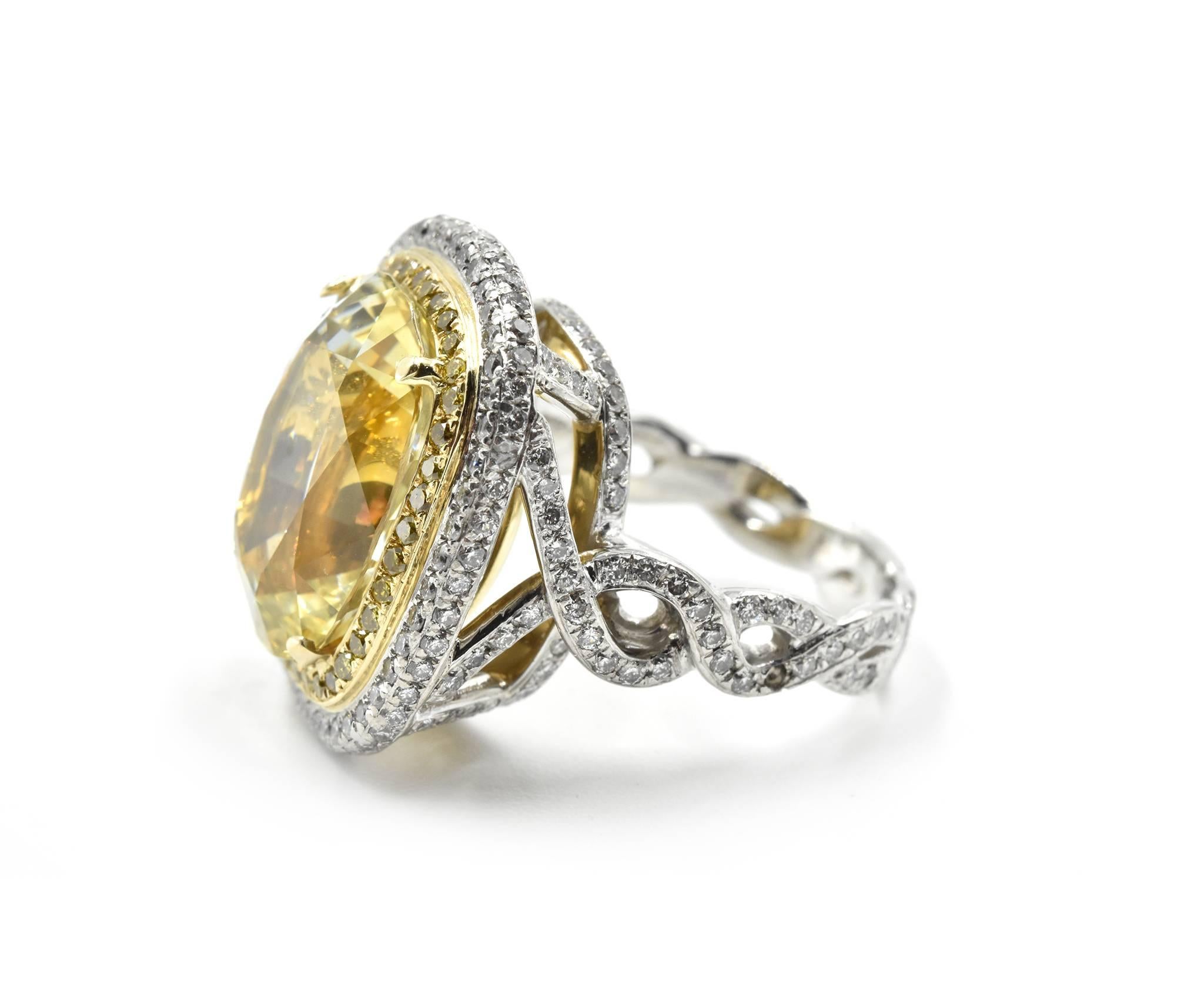 Designer: custom design
Material: platinum
Center Stone: 11.41 carat cushion cut yellow sapphire gemstone
GIA Cert #: 6197045509
White Diamonds: 225 white diamonds = 2.00 carat weight
Yellow Diamonds: 39 yellow diamonds = 0.39 carat weight
Total