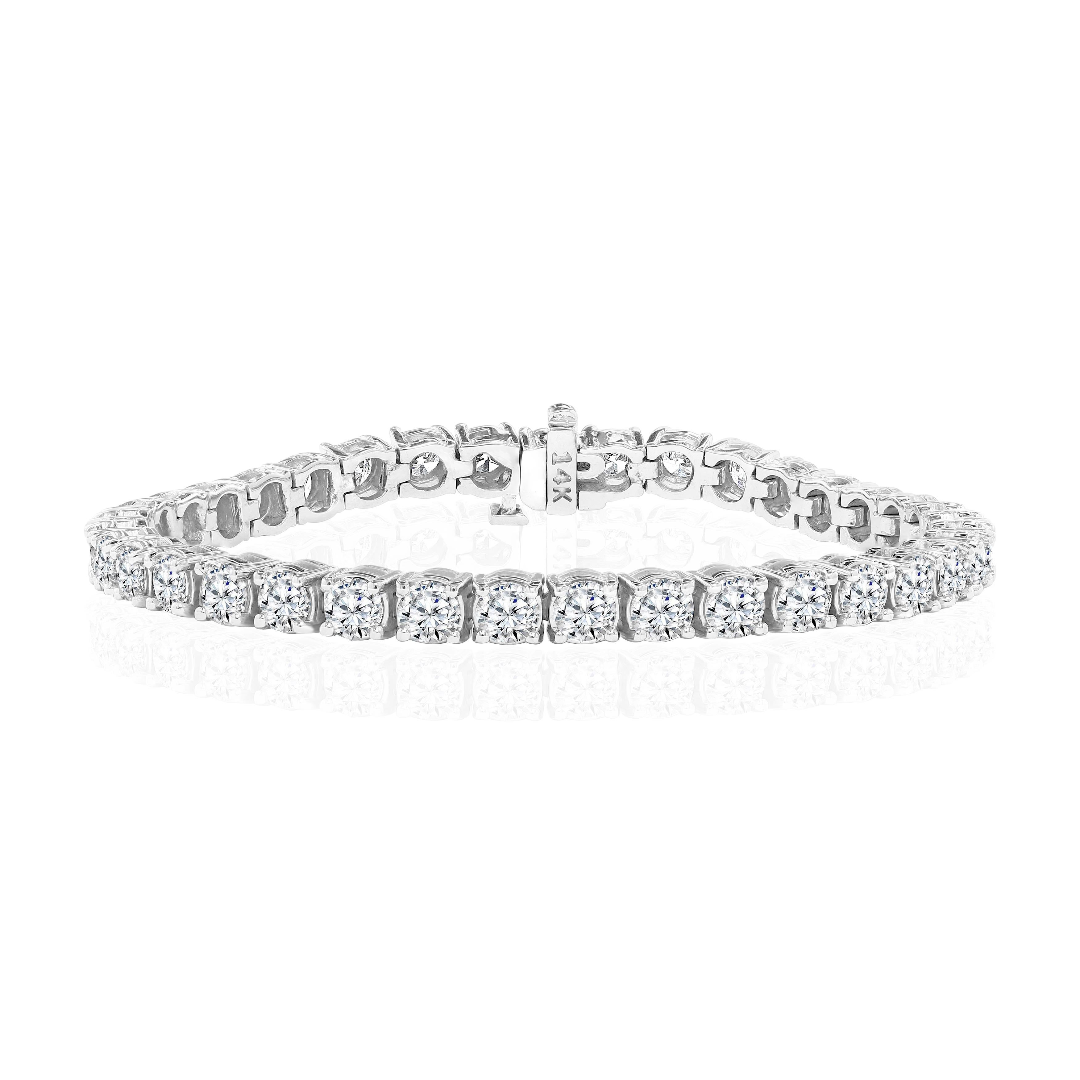 36 Round Brilliant Diamonds weighing 11.35 Carats and set in 14 Karat White Gold.

Diamonds are of H-I color and SI clarity.

Measures 6.75 inches.