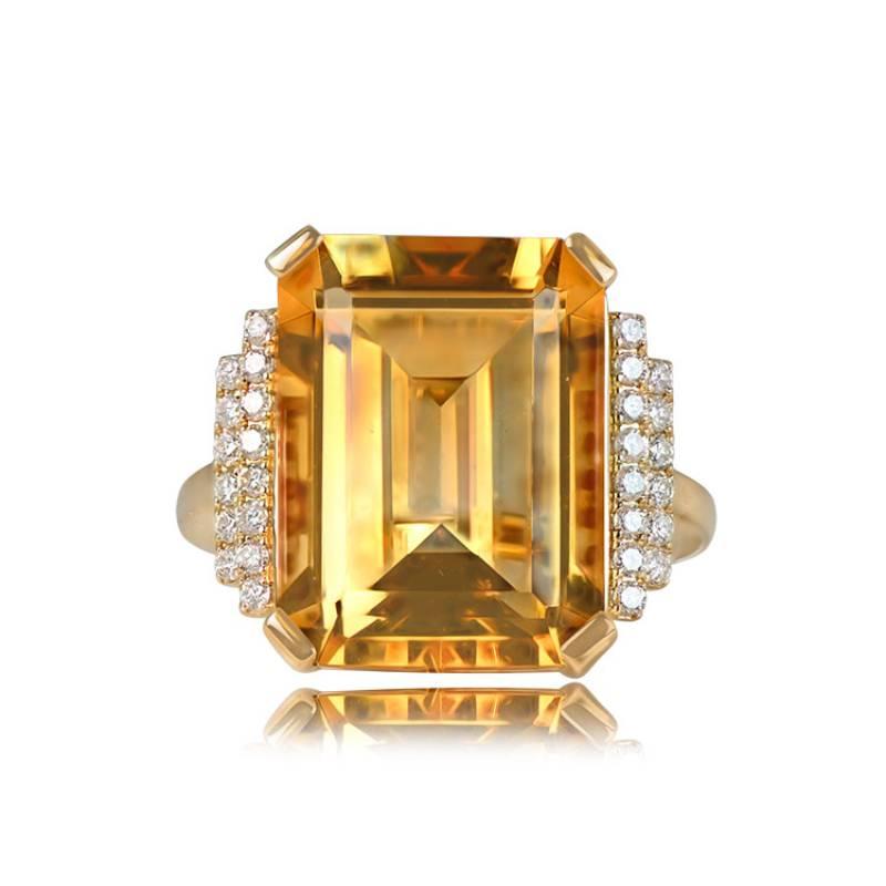 A stunning 18k yellow gold ring highlights an 11.35-carat emerald-cut natural citrine, prong-set at the center. The shoulders boast two steps of round brilliant cut diamonds. The under-gallery showcases intricate openwork, adding to the ring's