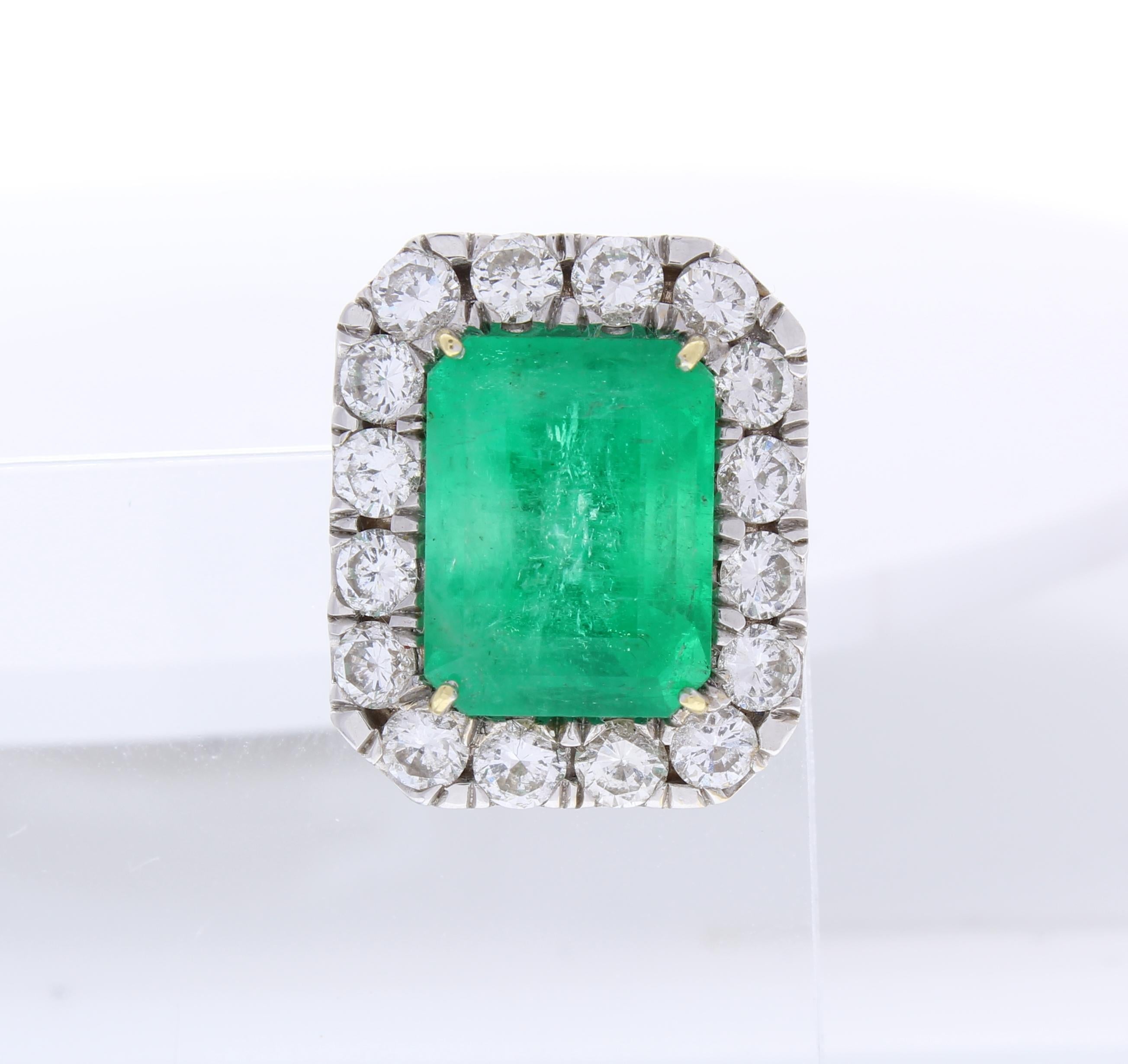 Elevate your look with a bold pop of color when you pair these exquisite emerald and diamond fancy stud earrings to your ensemble. The earrings feature attractive 11.36 carat total weight, green emeralds. These perfectly matched gemstones are