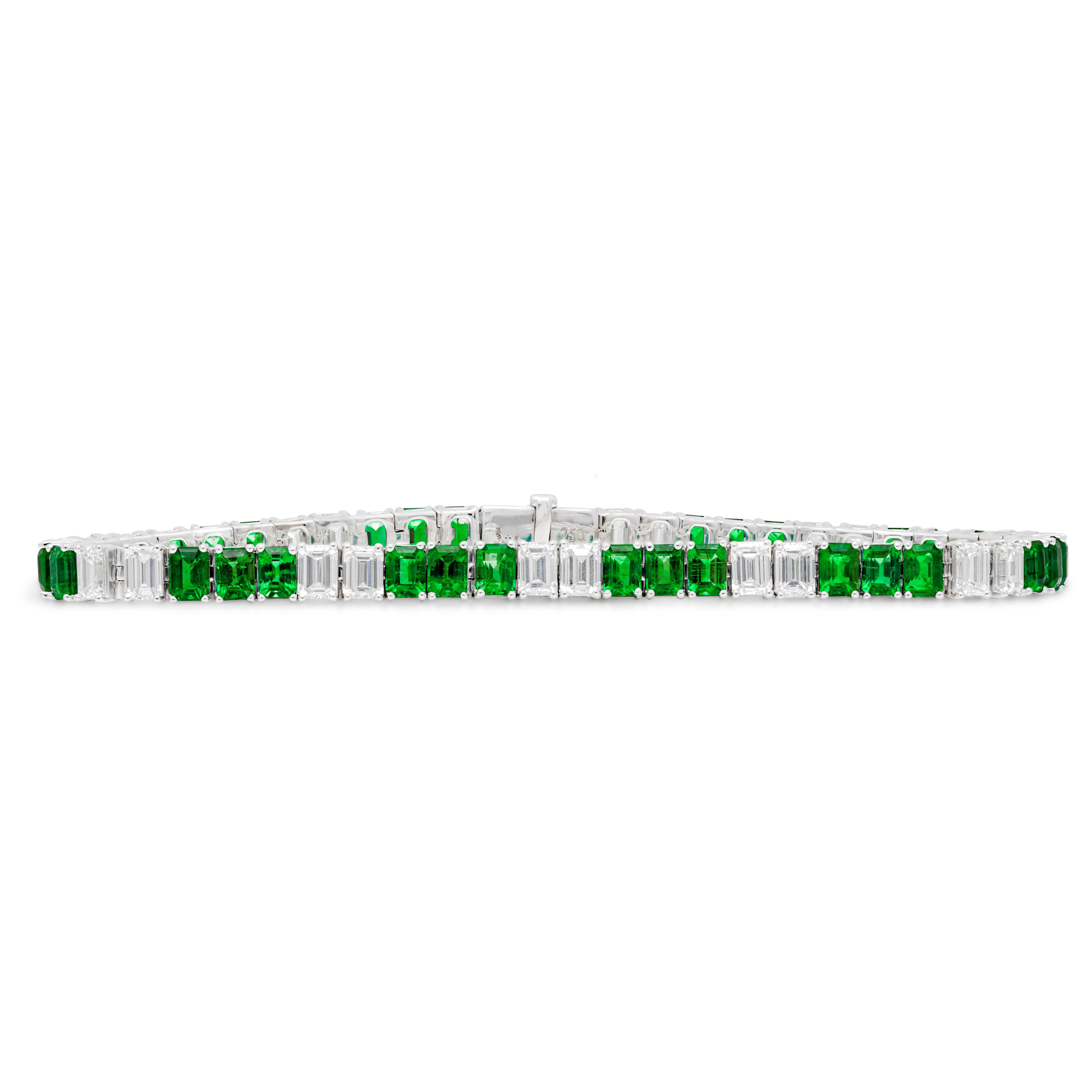An exquisite and simple tennis bracelet, showcasing 31 color-rich emerald cut emeralds weighing 6.01 carats total, elegantly spaced with 24 emerald cut brilliant diamonds weighing 5.35 carats total with F color and VS clarity. Set on a classic four