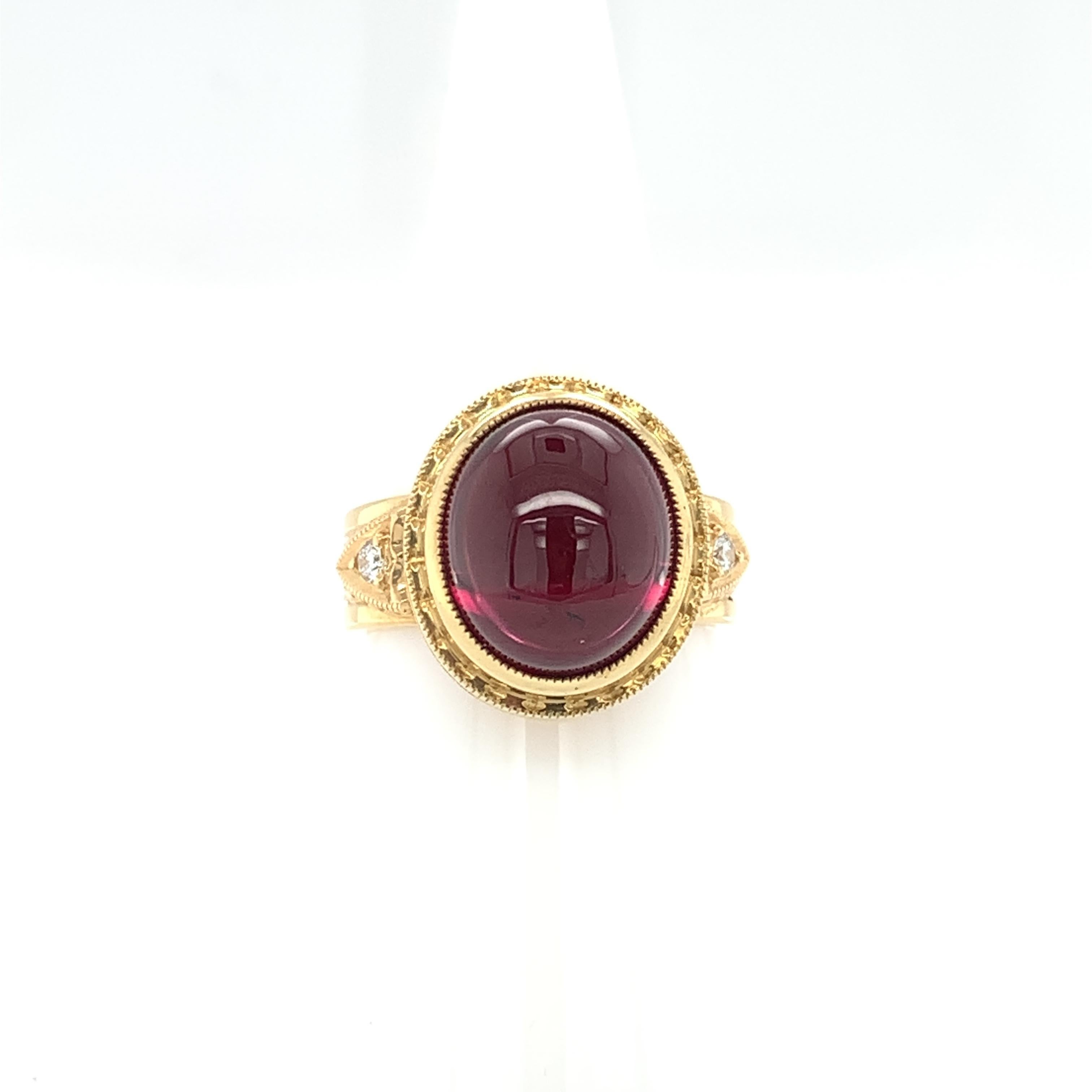 This beautiful dome ring features a gorgeous 11.39 carat rubellite tourmaline cabochon set in a handmade, 18k yellow gold bezel. Rubellite is the variety of tourmaline with deep purplish or reddish pink color and this gem is a fine example of top