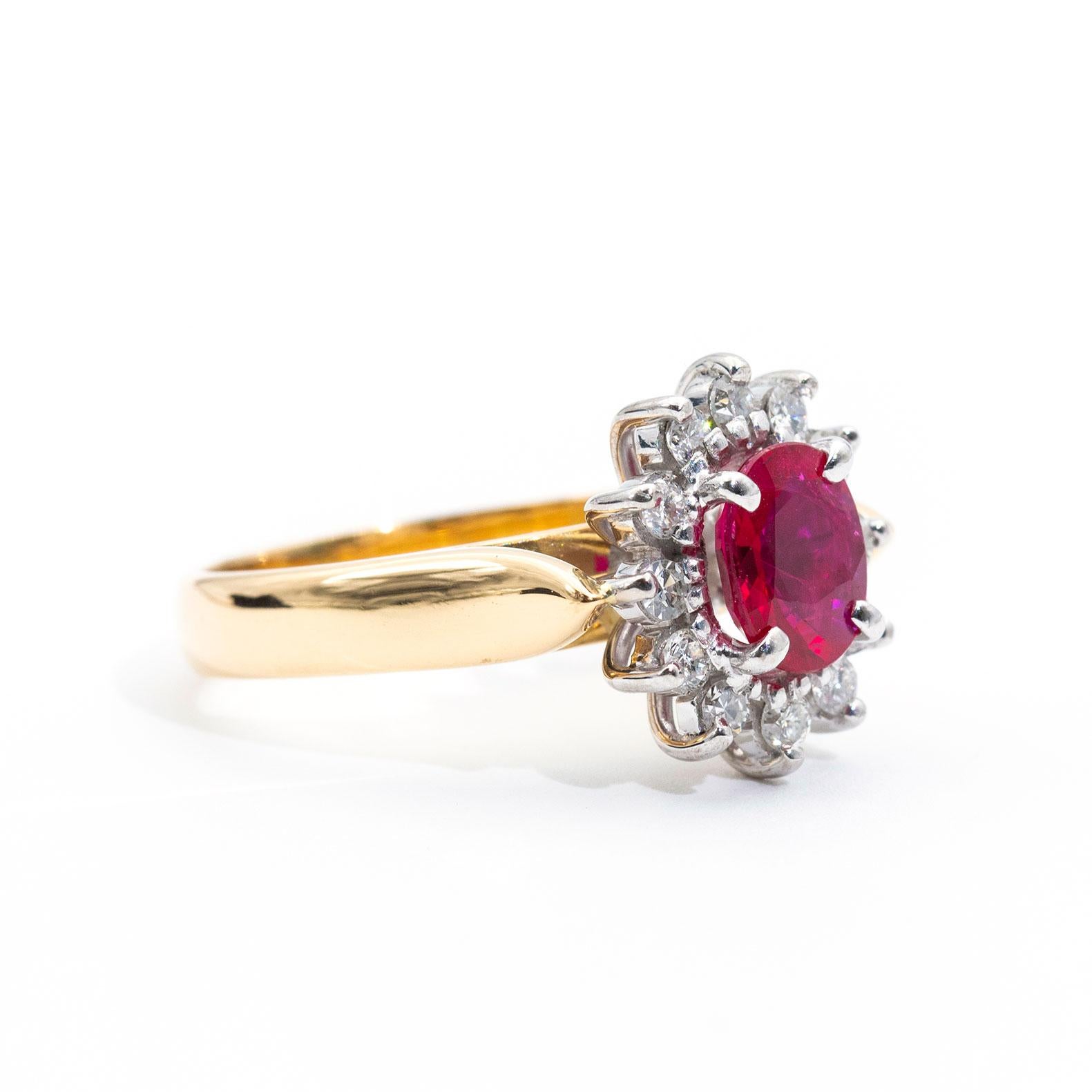 The gorgeous handmade vintage ring is forged in 18 carat yellow and white gold and features a captivating bright red 1.14 carat natural ruby and is surrounded by a charming border of round brilliant cut diamonds. We called this stunning piece The