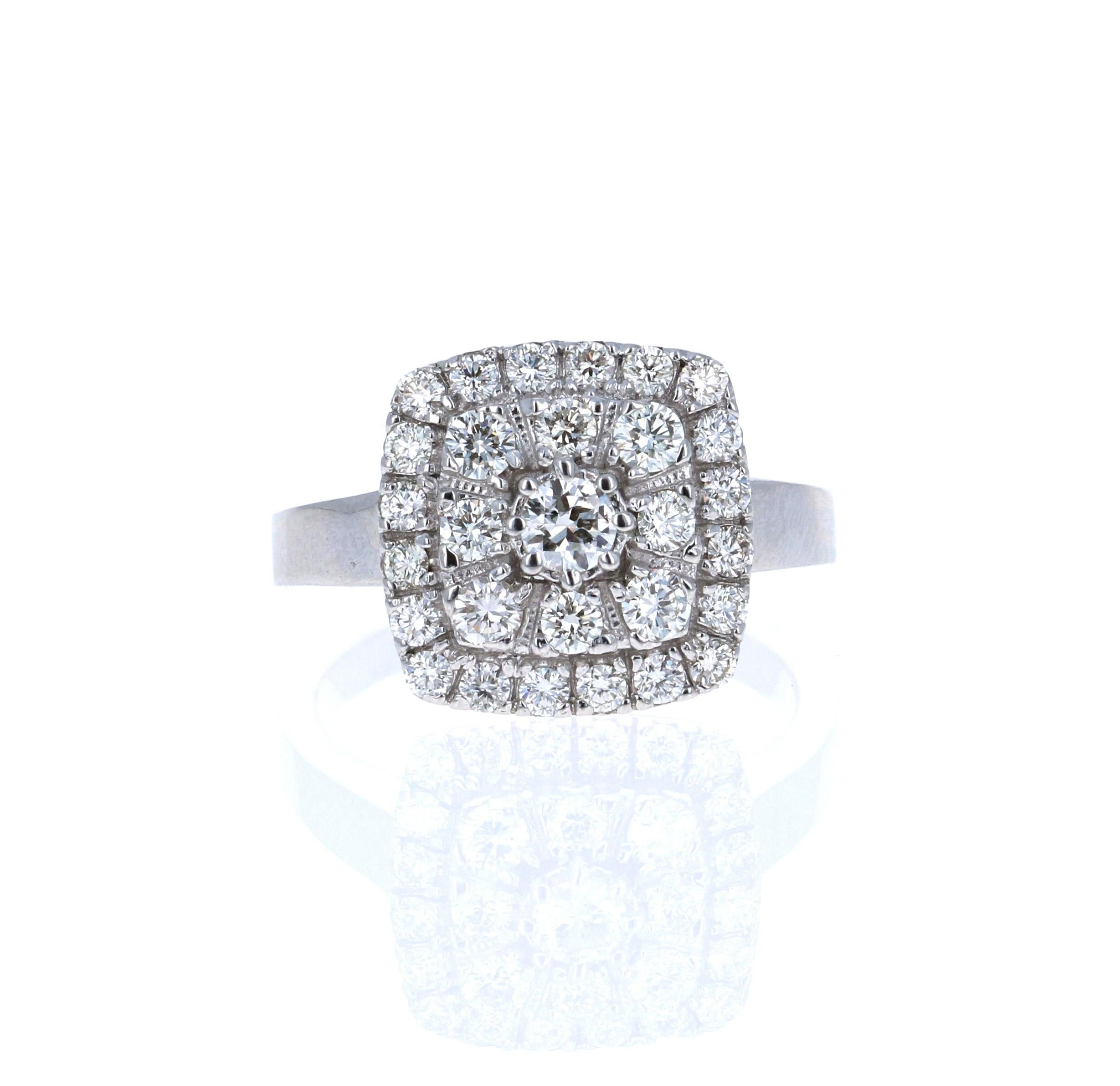 This ring has a cluster of Round Cut Brilliant Diamonds that weigh 1.14 Carats. The Clarity and Color of the Diamonds are VS-F. 

It is beautifully set in 18 Karat White Gold and weighs approximately 8.7 grams

The ring is a size 7 and can be