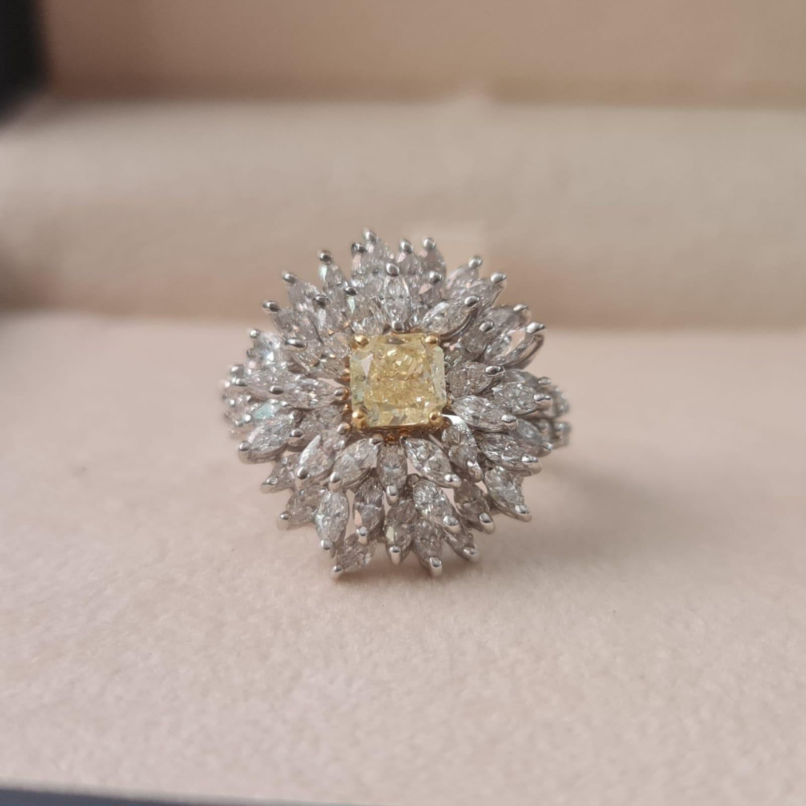 This gorgeous diamond ring features a  1.14 carat center GIA Fancy Yellow diamond , adorned with 3.43 carat natural diamonds D-F VS.

One of a kind!

Ring Material: 18K White Gold
Total Diamond Weight: 4.57 Carat
Total Weight: 10.84 gr

Center