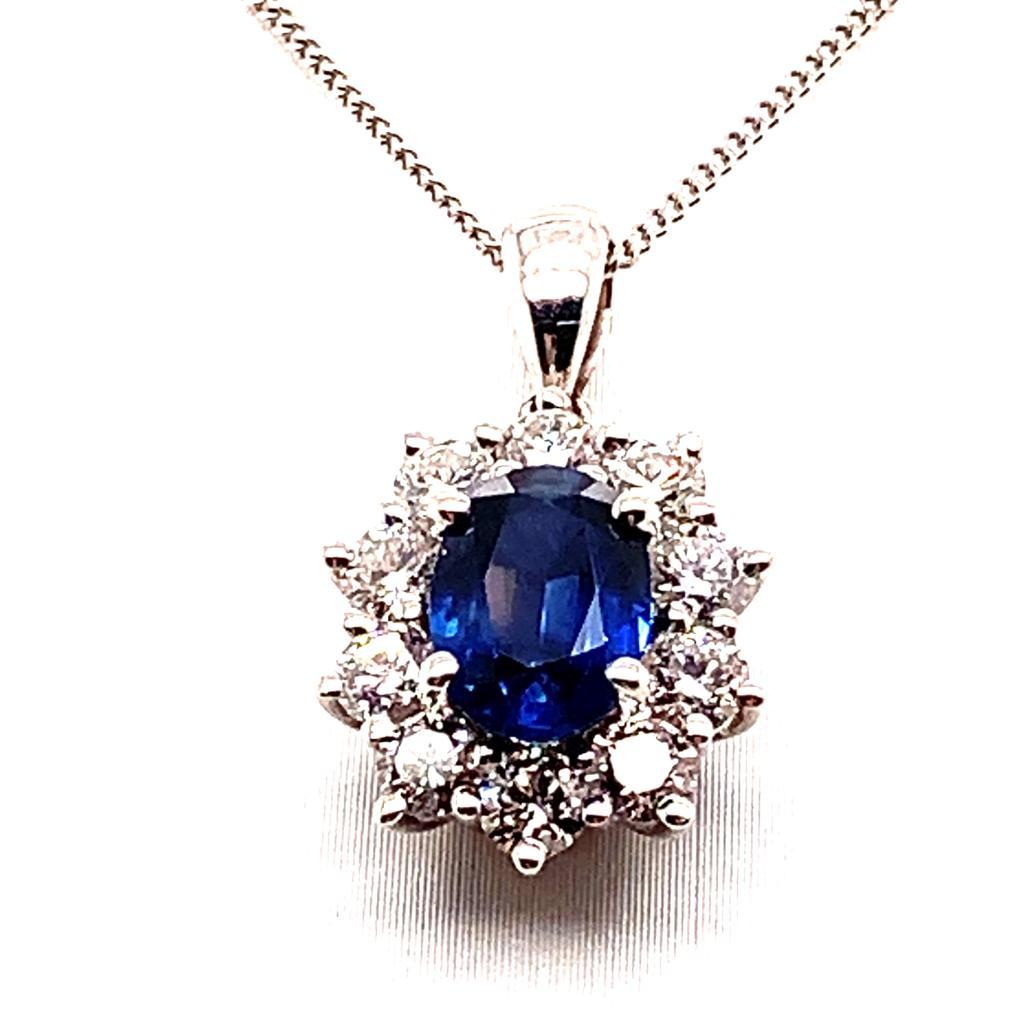 Women's 1.14 Carat Oval Cut Blue Sapphire and Diamond Pendant in 18K White Gold For Sale