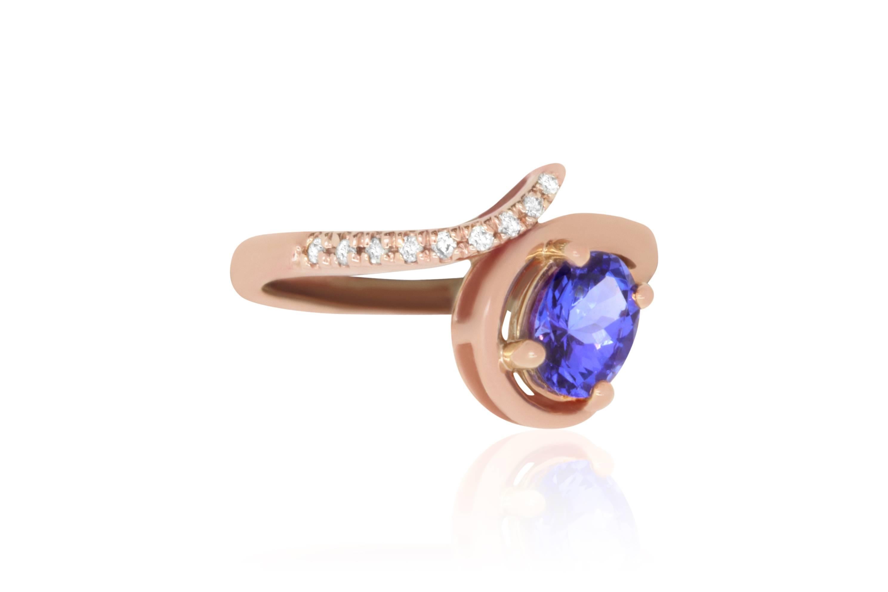 When receiving this 1.14 Carat Oval Tanzanite, we knew just what to do! Set in 14k Rose Gold and a row of 0.07 diamonds, you will fall in love with this dainty piece. 

Material: 14k Rose Gold 
Center Stone Details: 1.14 Carat Oval Cut Tanzanite.