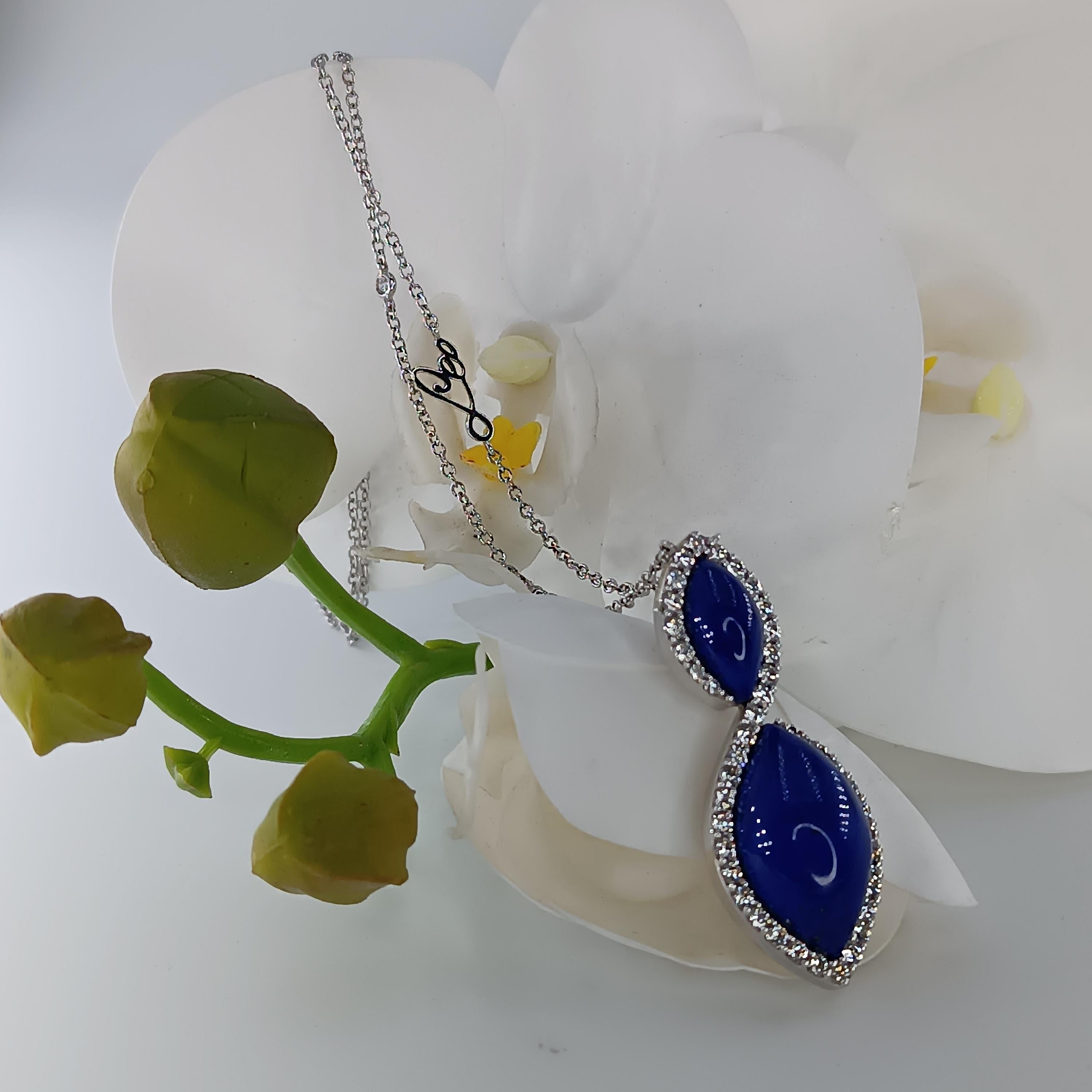 This wonderful Leo Milano pendant from our Pagano collection shows in every detail a very complicate yet perfectly done workmanship. The pendant and the chain are in 18 carat white gold with lapislazuli . The object weights 13,49 grams the total