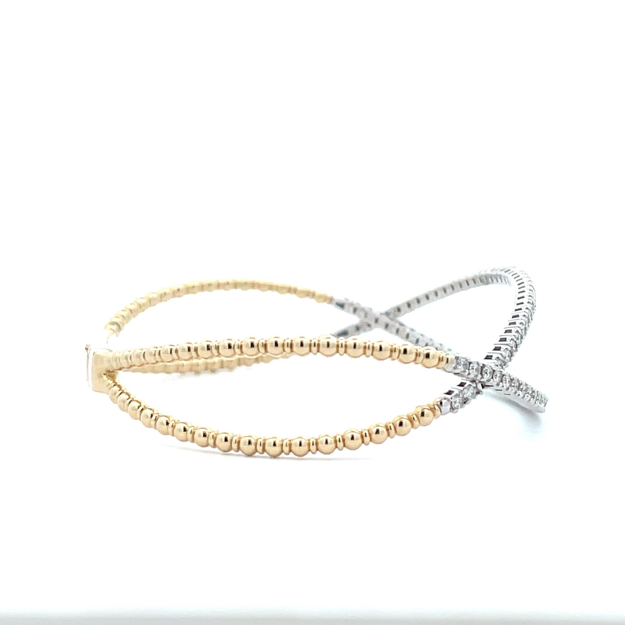 Add an extra touch of elegance to your wardrobe with this gorgeous Diamond infinity criss cross bangle. Crafted in 14K solid gold, this piece features flexible gold beads and pave set diamonds. This versatile accessory can be worn alone or stacked