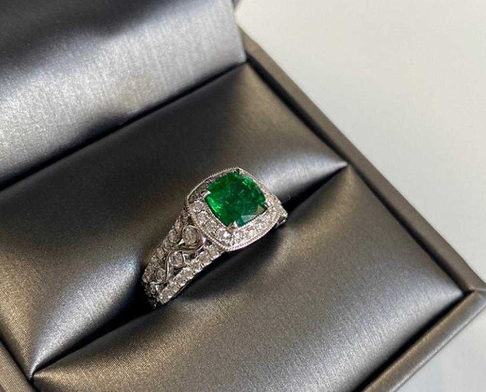 Emerald Weight: 1.14 CTS, Measurements: 6.3 x 6.3 mm, Diamond Weight: 0.68 CT, Metal: 18K White Gold, Ring Size: 6.5, Shape: Cushion, Color: Green, Hardness: 7.5-8, Birthstone: May
