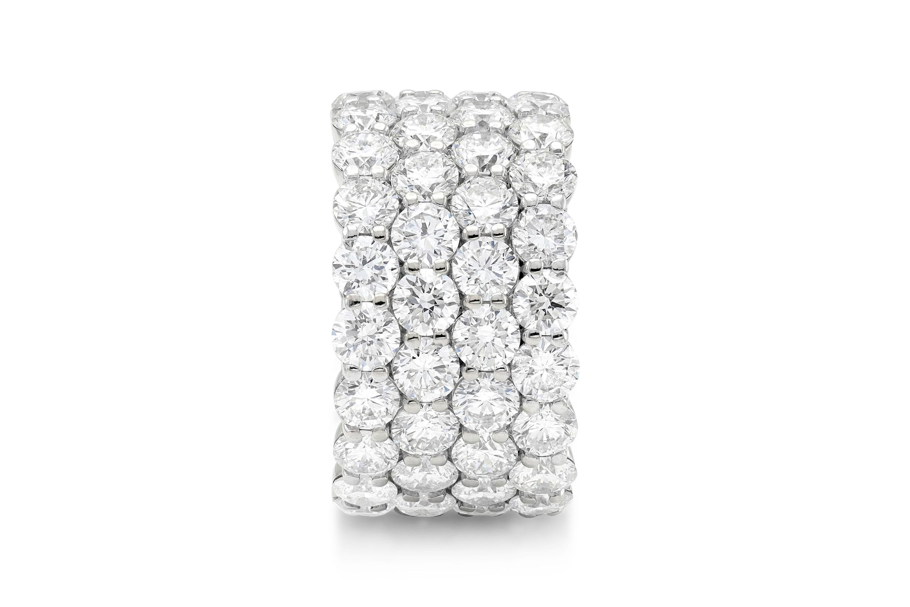 Finely crafted in platinum with 4 rows of round brilliant cut diamonds weighing approximately a total of 11.40 carats.
E-F color, VVS-VS clarity
Size 5 1/4