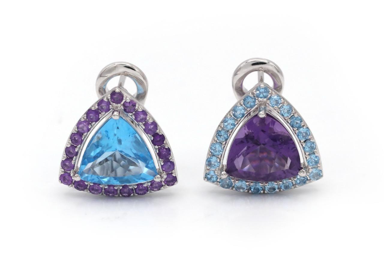 The off-beat stunning combination of blue and purple featuring the 4.34 carat blue topaz and 7.08 carat amethyst is a great way to highlight your individuality. The trillion cut gemstones surrounded with contrasting matching amethysts and blue topaz