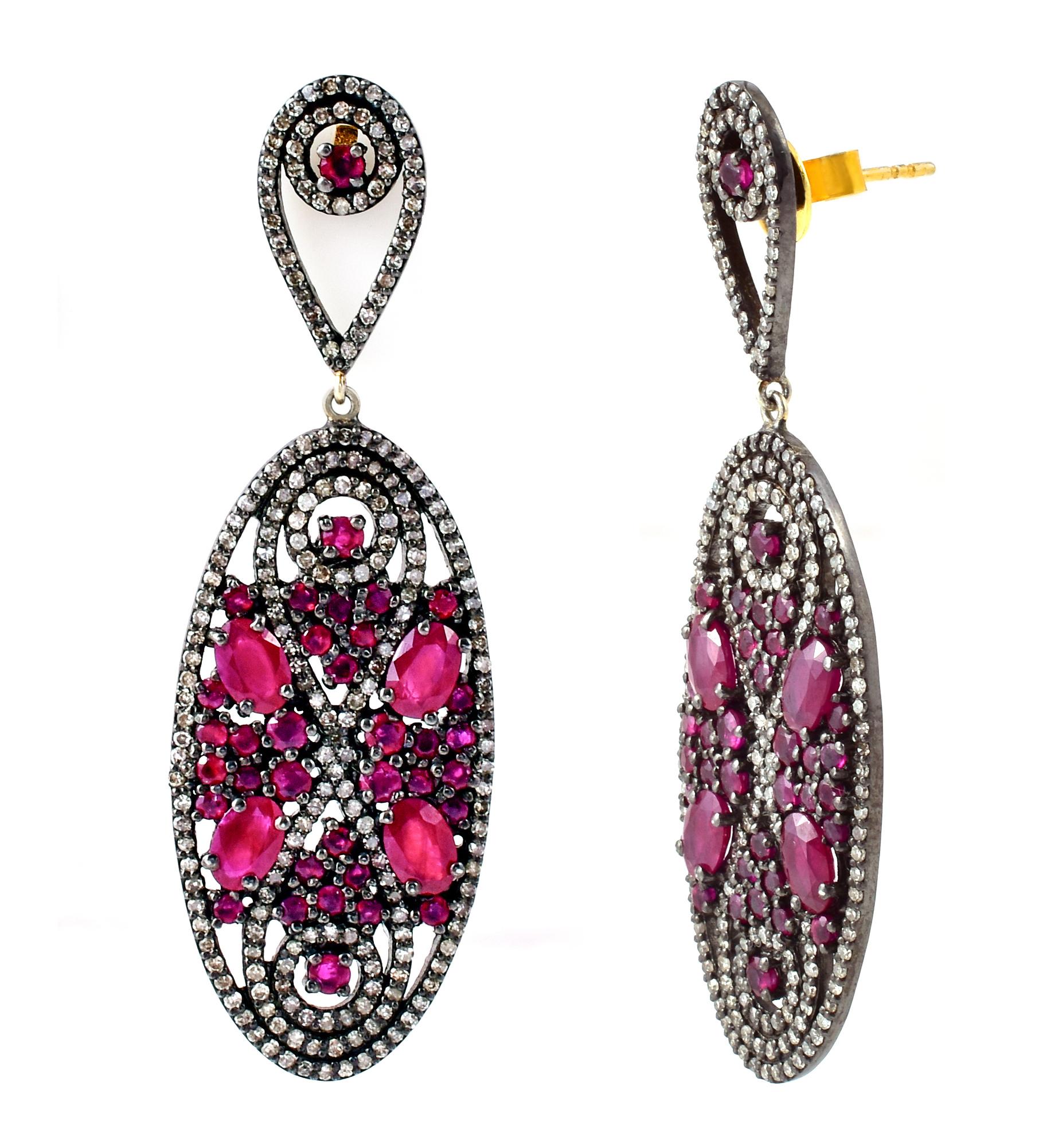 11.42 Carat Diamond and Ruby Drop Earrings in Victorian Style

This Victorian style crimson red ruby and diamond hanging earring is magnanimous. The bottom oval shape formed with a single row of pave set diamonds creates the perfect border. The