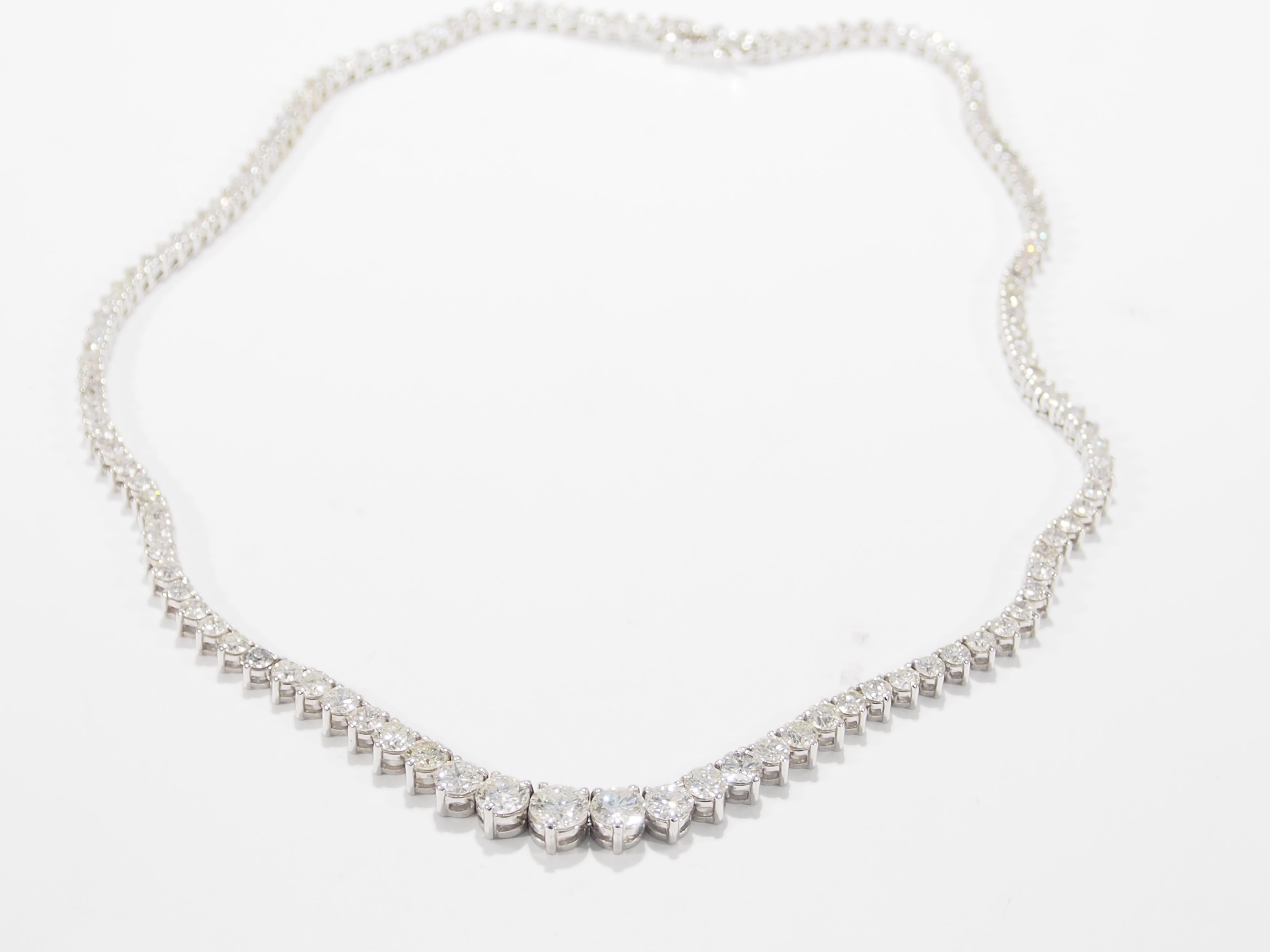 This is a luxurious 14K White Gold Diamond Tennis Necklace. A stunning Necklace with 135 Round Brilliant Cut Diamonds, approximately 11.42ctw, F-J in Color, VS-I1 in Clarity that graduates in size  from the center to the clasp. This divine Diamond