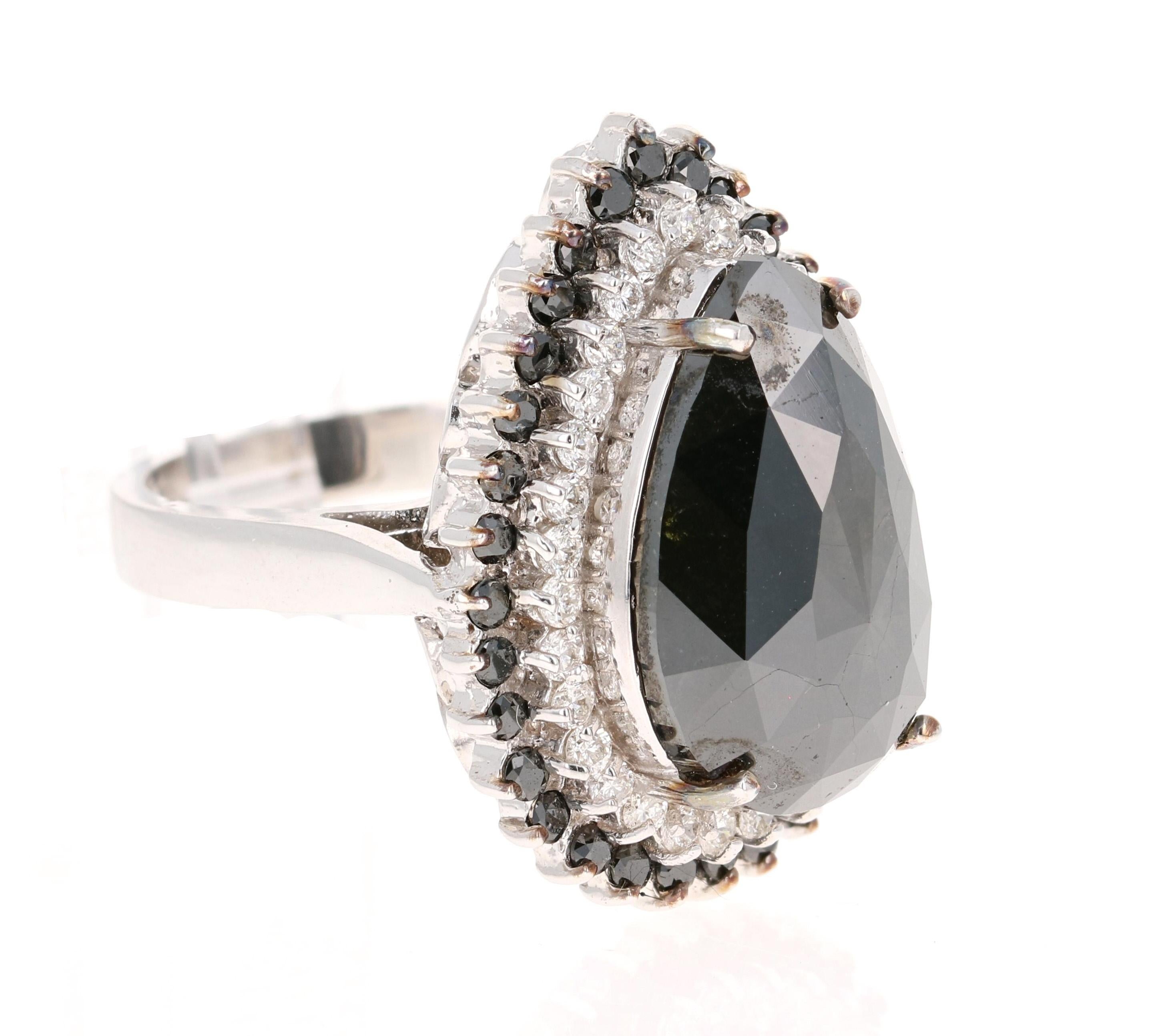 This Black and White Diamond Cocktail Ring is simply a Stunning Beauty! 

The Pear Cut Black Diamond is 9.92 Carats and is surrounded by a halo of 31  Round Cut Diamonds weighing 0.68 Carats (Clarity: SI, Color: F). Additionally it has 32 Black