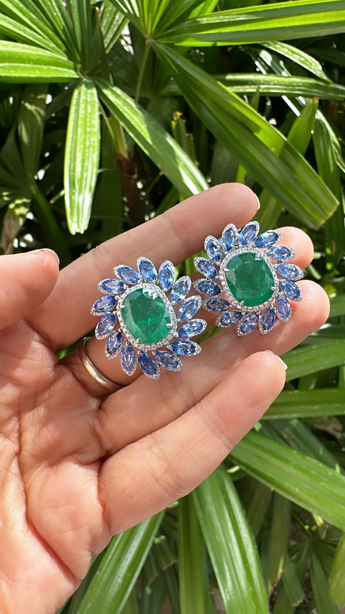 A very beautiful and gorgeous, one of a kind, Emerald & Blue Sapphire Stud Earrings set in 18K White Gold & natural Diamonds. The weight of the Emeralds is 11.46 carats. The Emeralds are completely natural, without any treatment and are of Zambian