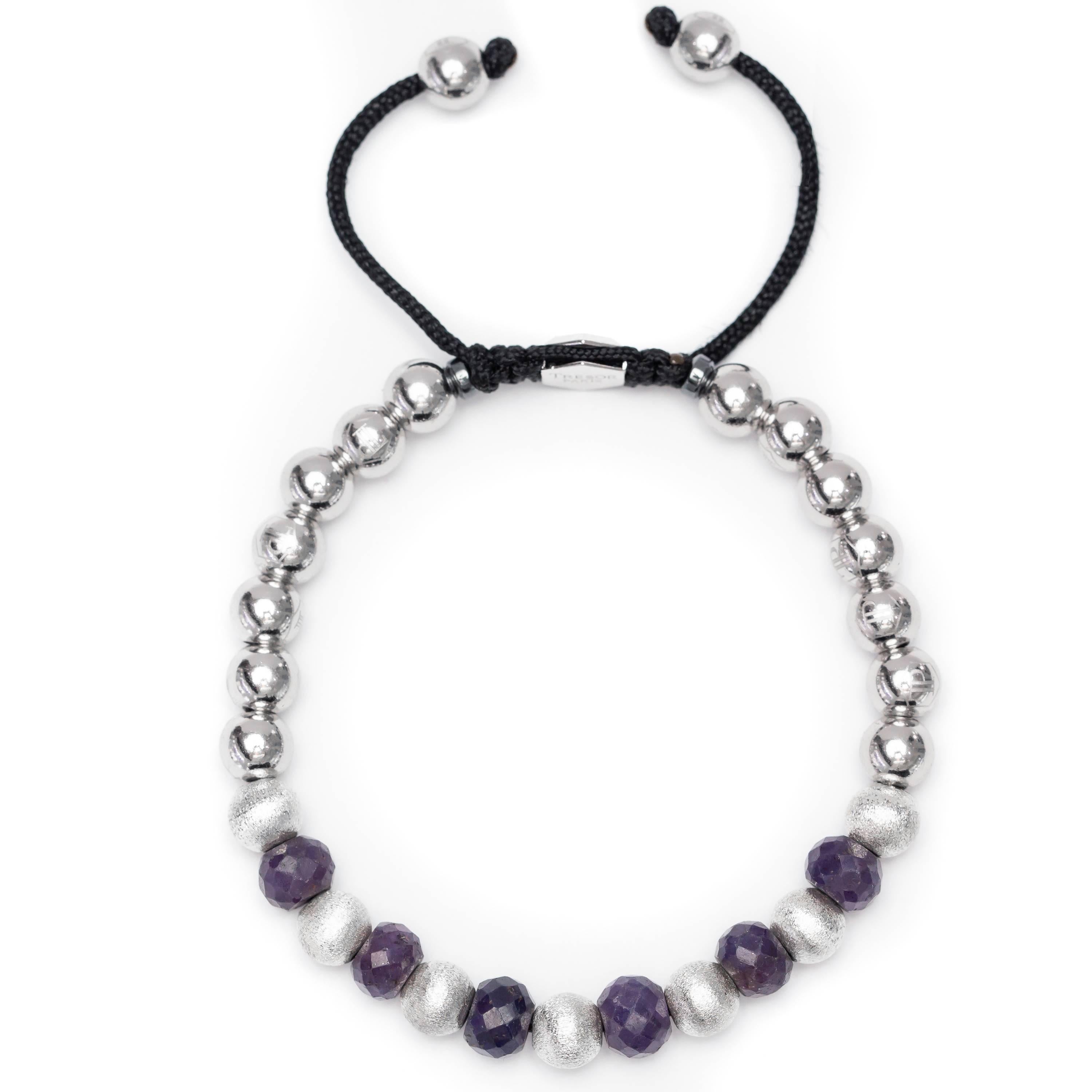 A bespoke This particular one has 11.46 Carat Blue Sapphire Stainless Steel and Silver Macrame beaded bracelet from The Original Tresor Paris Caresse Bleu Collection. This Bracelet features 7 satin beads and 14 Stainless Steel beads with a Silver