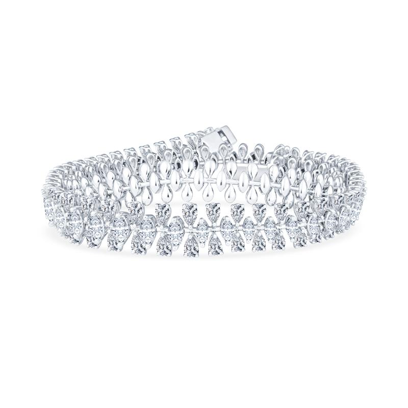 This unique and fun necklace features 11.47 carat total weight in marquise and pear shaped natural diamonds set in 18 karat white gold. It detaches into two bracelets for many other ways to wear. Wear as a necklace, wrap bracelet, two bracelets