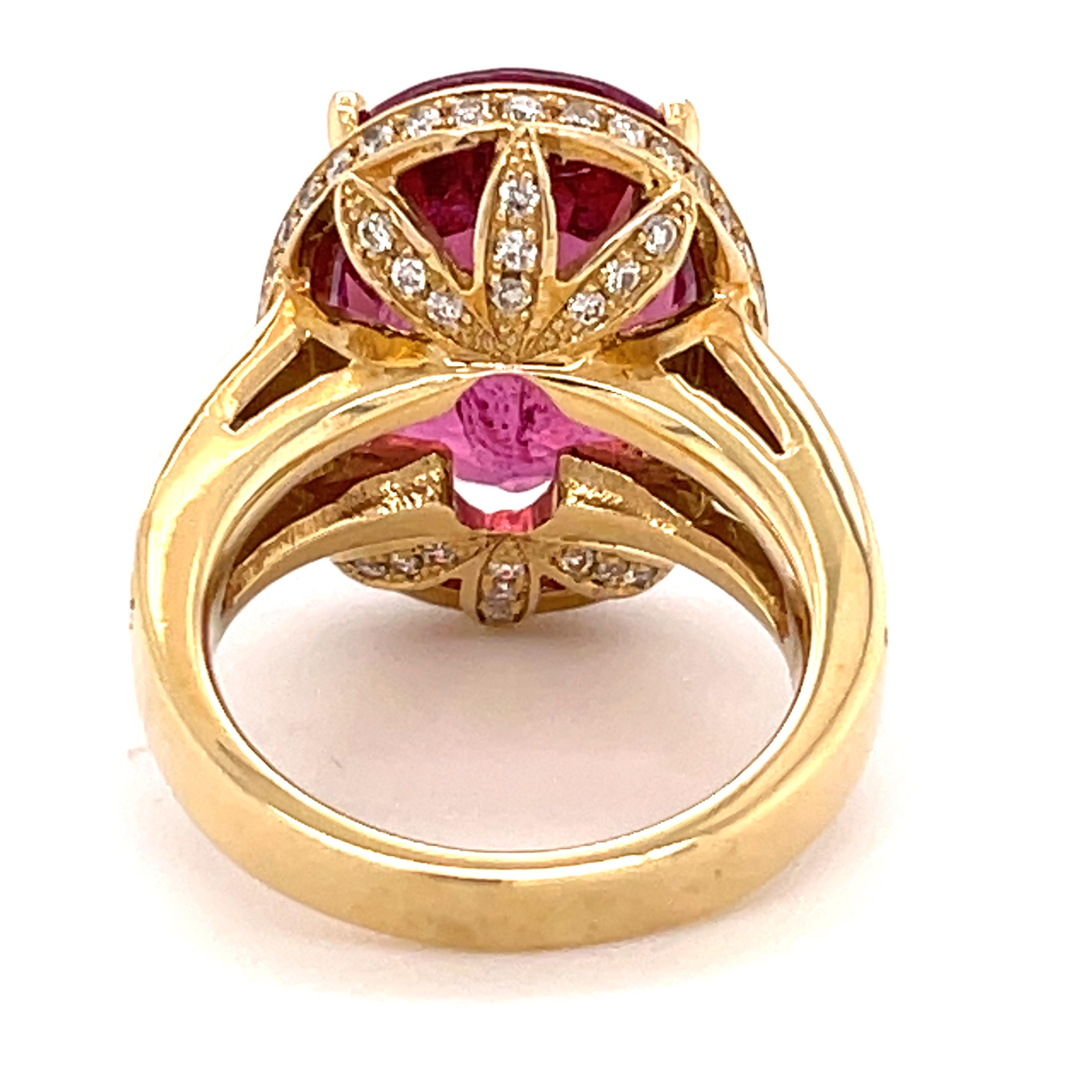 Pink Tourmalines with no inclusions are very rare. They are accepted in the trade with internal identifying characteristics and are classified as type 3 stones. The vibrant pink/purple Tourmaline in this ring weighs 11.49 carats (16.2 x 13.0 mm) and