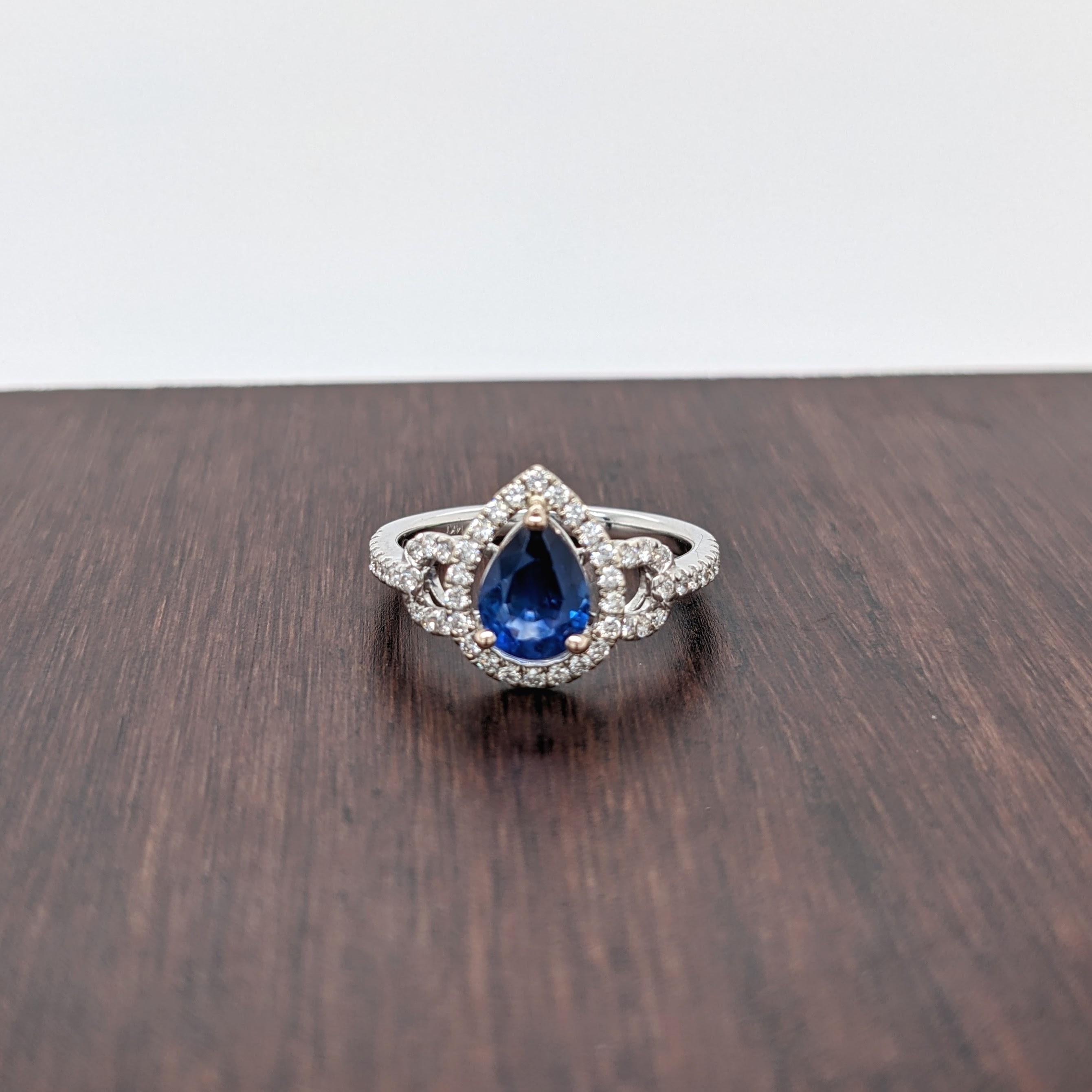 Stunning is an understatement for this ring! The all natural diamond halo and accents perfectly emphasize the vivid blue in this sapphire from Ceylon. The halo design gives a slightly vintage feel but in the most elegant way. This ring is now ready