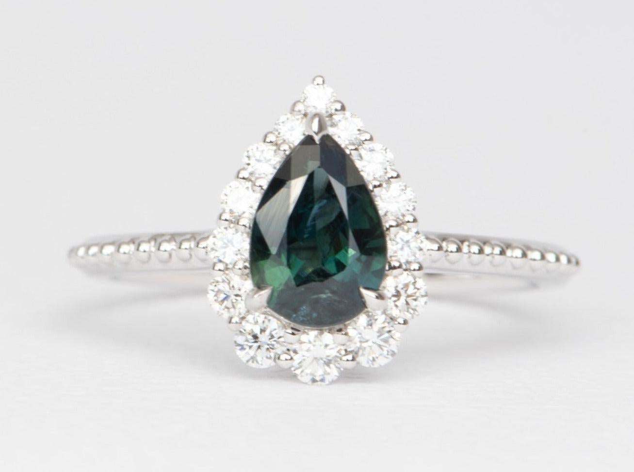 ♥ Solid 14k white gold ring set with a beautiful pear-shaped teal blue Nigerian sapphire with diamond halo
♥ Gorgeous teal blue color!
♥ The item measures 12.5 mm in length, 8.7 mm in width, and stands 6.3 mm from the finger

♥ US Size 7 (Free