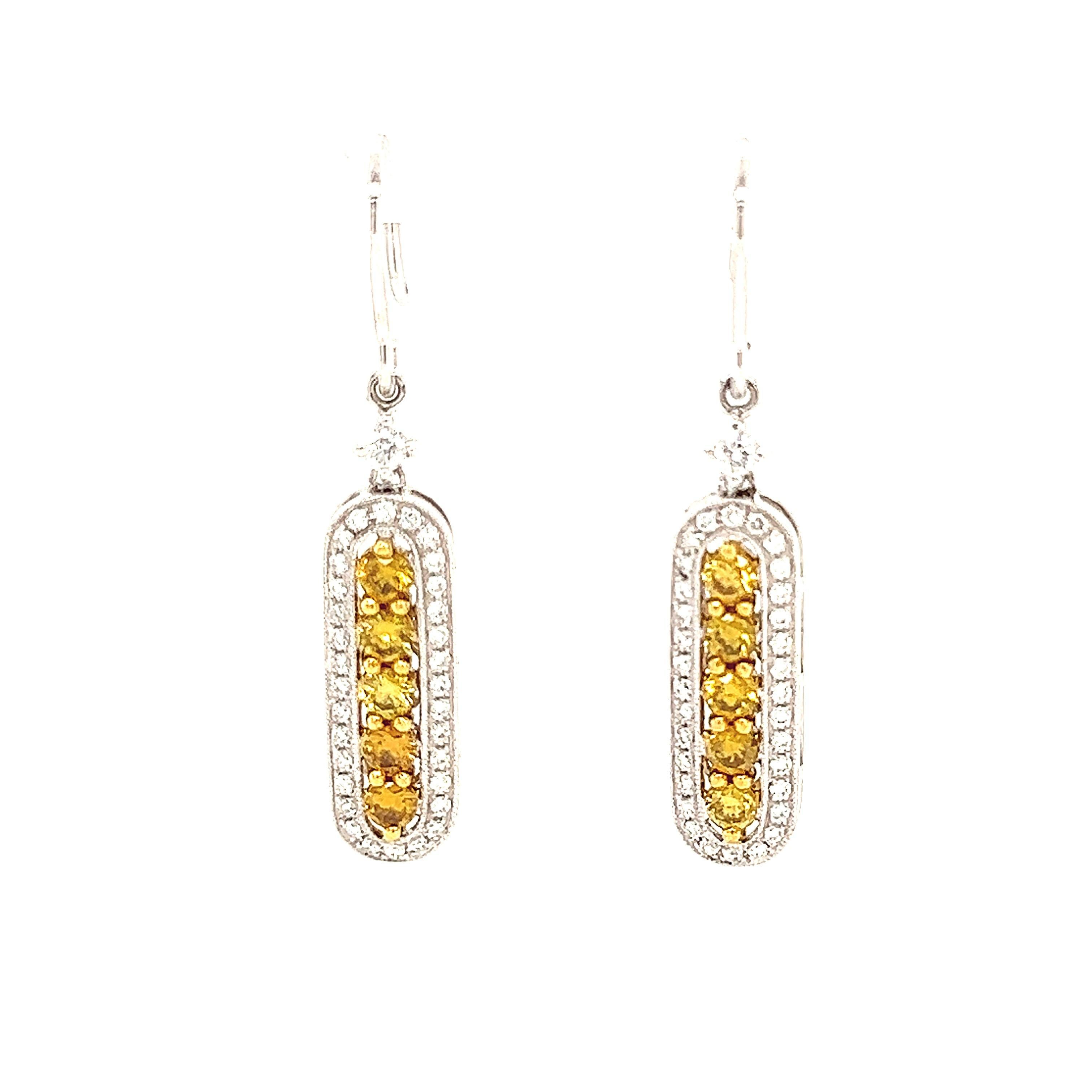 Unique modern pear shape rose cut diamond with loop drop earrings.
1.14 carats total diamond weight.
10 round yellow diamonds, 1.14 carats. Approximately Fancy Greenish Brownish Yellow color and SI1 clarity. Complimeted with 66 round diamond,