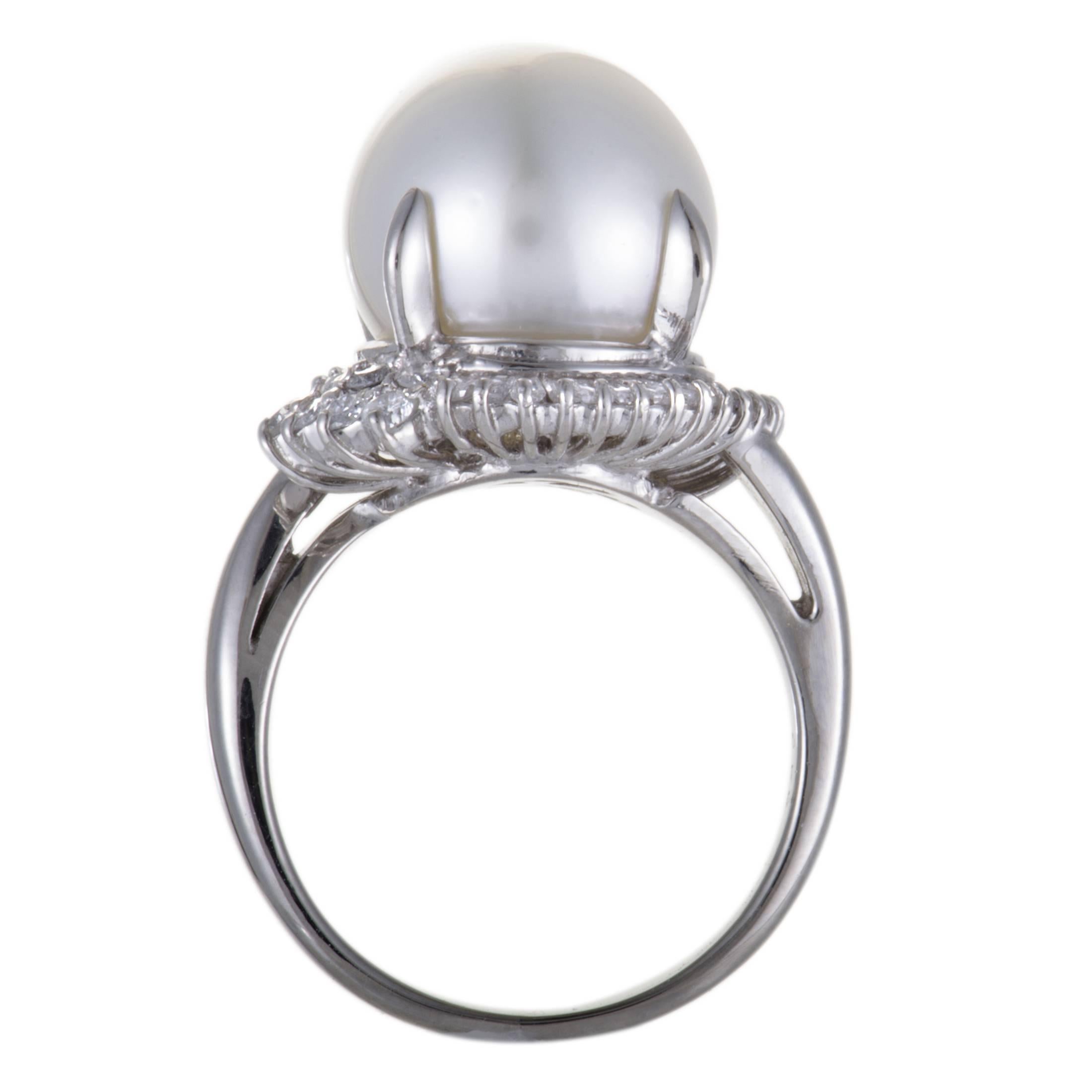 Offering a look of sublime elegance and refinement, this gorgeous ring is made of gleaming platinum and set with a splendidly feminine white pearl, while the 0.50 carats of scintillating diamond stones add a touch of ever-lasting brilliance to the