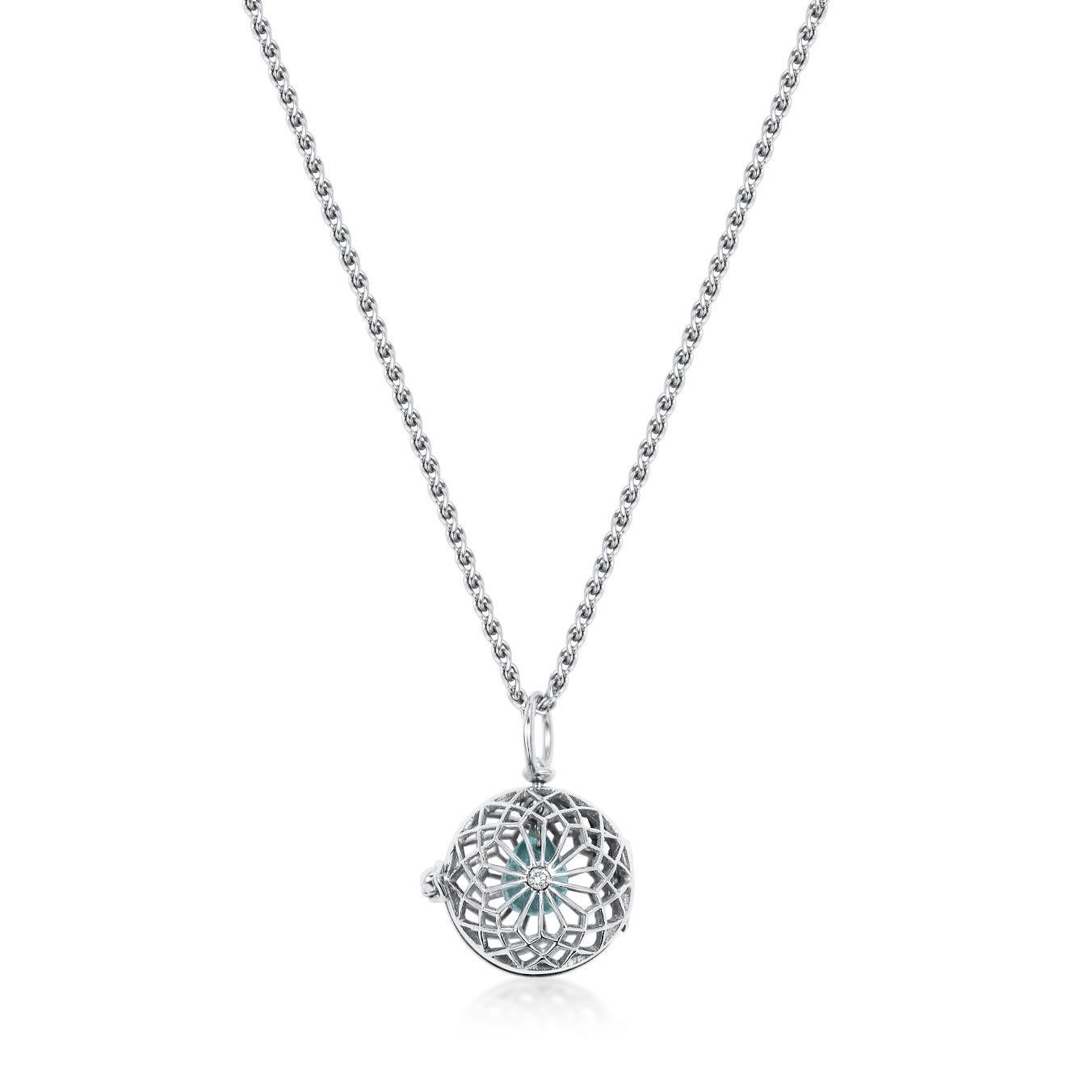 Handcrafted 1.15 Carat Aquamarine & Diamond 18 Karat White Gold Pendant Necklace. Inspired by the gesture of giving someone your heart and for them to keep it safe. A drop of Aquamarine swings in our hand pierced yellow gold cage highlighted by a