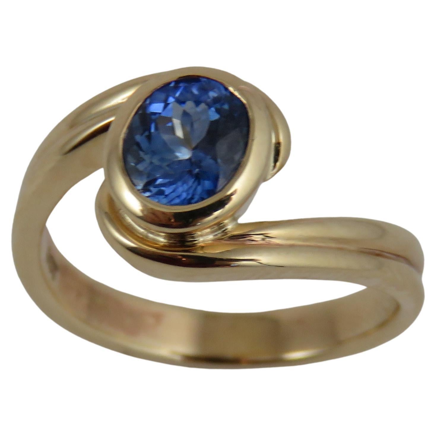 1.15 Carat Blue Sapphire 9k Yellow Gold Bypass Ring For Sale