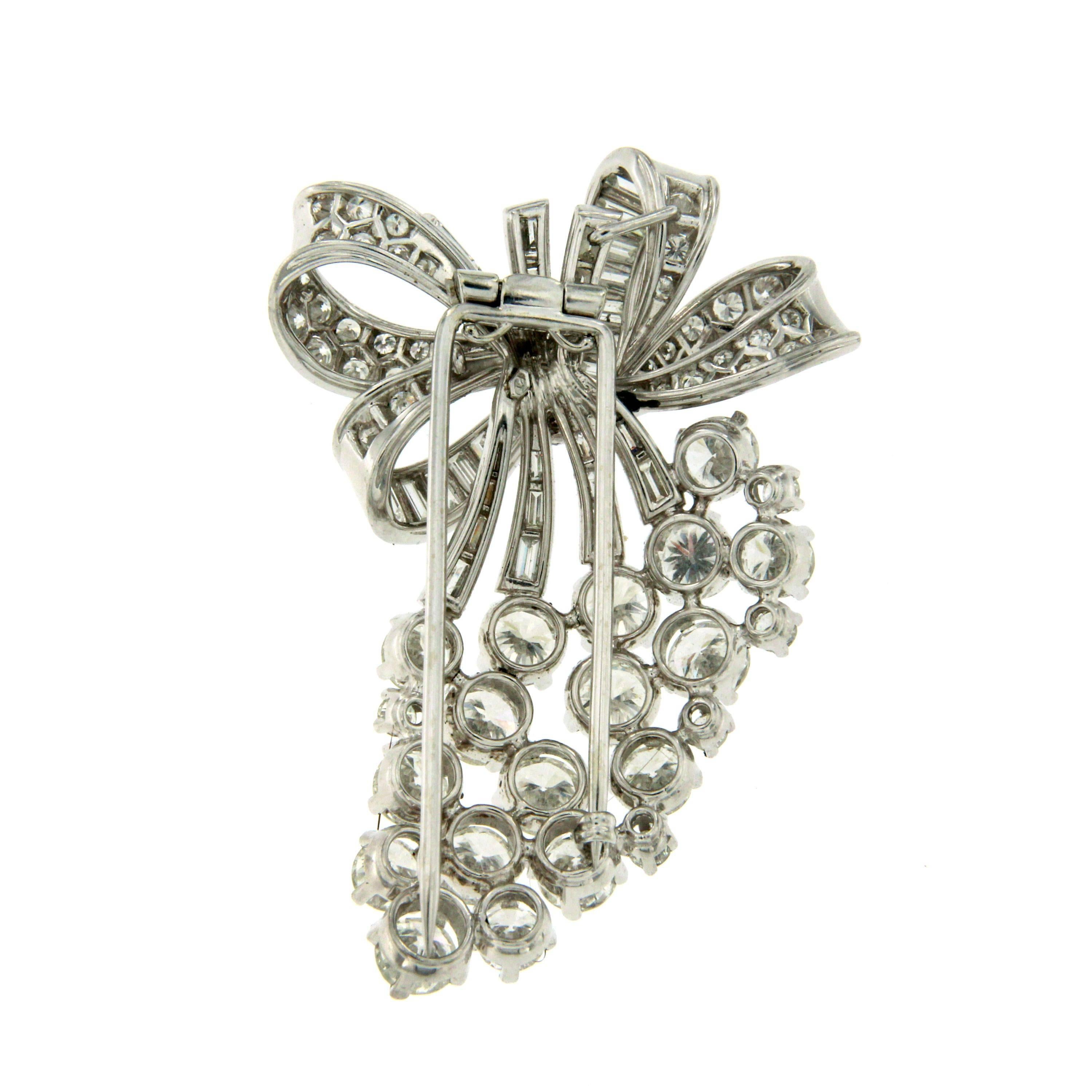 A fabulous Art Deco brooch set with approx. 11.5 total ct of round/baguette cut diamonds.
Handmade Platinum mounting;  This piece is designed and crafted entirely by hand in the traditional way, using age old techniques and processes. Signed Maison
