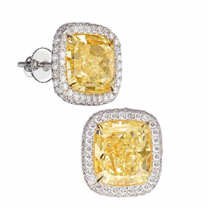 Clarity: VS1
Earring Backing: Screw Post
Earring Style: Stud
Metal: Platinum
Stone: Fancy Yellow Diamond
Stone Shape: Round, Cushion Cut
Total Diamond Carat Weight: 11.5ctw
Center Diamond Weight: 5.2ctw / 5ctw
Total Number of Yellow Diamond Stones: